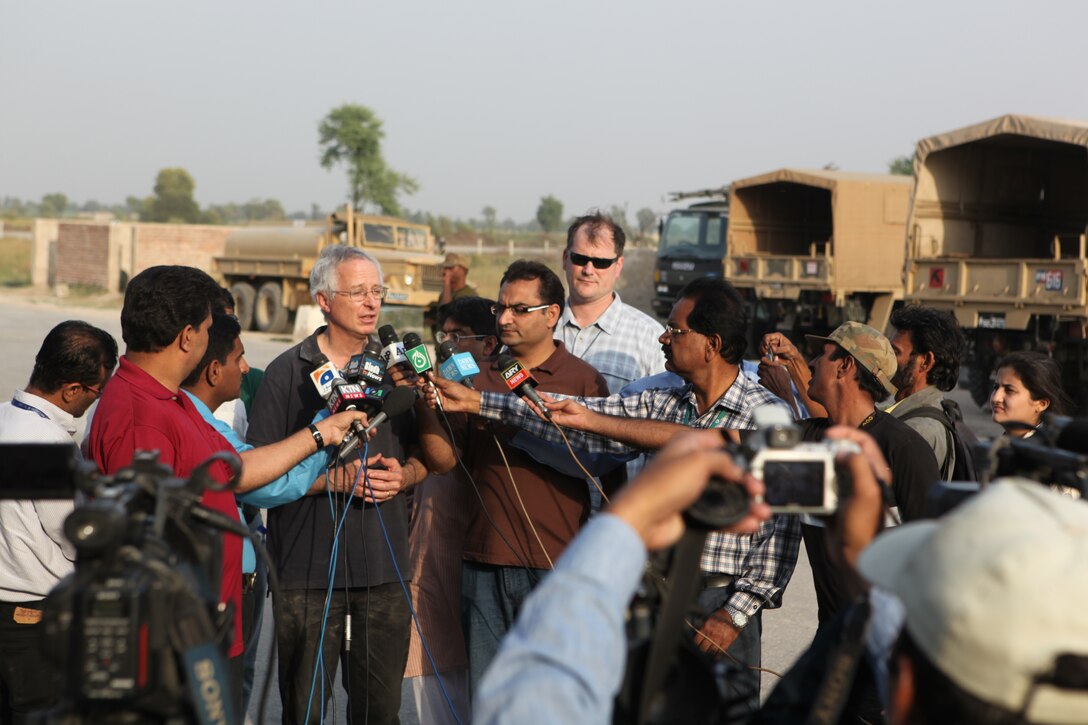 Newly-appointed U.S. Ambassador to Pakistan Cameron P. Munter speaks with members of the Pakistani press, Oct. 30, 2010, at Pano Aqil Cantonment, Pakistan. The ambassador visited Pano Aqil to see first-hand the Pakistan and U.S. military flood relief efforts conducted in Sindh Province, Pakistan, as well as to participate in a humanitarian mission bringing relief supplies to flood victims. 26th and 15th Marine Expeditionary Units have been flying CH-53E Super Stallion and CH-46 Sea Knight helicopters to isolated locations in Sindh province since early September and have transported more than 3.7 million pounds of relief supplies to 150 different locations in southern Pakistan.