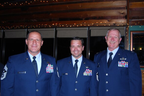 COCOA BEACH, Fla. - (Left) Air Force Reservists from the 920th Rescue Wing, Command Chief Master Sgt. Gerald Delebreau, stands next to Master Sgt. Shane Smith (center), 920th Rescue Wing combat loadmaster and Col. Robert Dunn (right), 920th Rescue Wing commander, at an Air Force Week recognition dinner at the historic Cocoa Beach Pier, Oct. 29. The theme of A.F. Week was recognizing hometown heroes and the sacrifices Airmen make, deployed and at home. To show his support, Chief of Staff of the Air Force, Gen. Norton A. Schwartz attended from Washington D.C. (U.S. Air Force photo/Master Marian Smith).