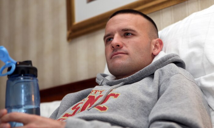 Relaxing on his hotel bed, Capt. Richard Jennings watches TV at about 5 a.m. Oct. 31, three hours before the start of the 35th annual Marine Corps Marathon. “I woke up, ate some oatmeal, a banana and a bagel with some peanut butter on it,” Jennings said. “I’m feeling good and rested.”