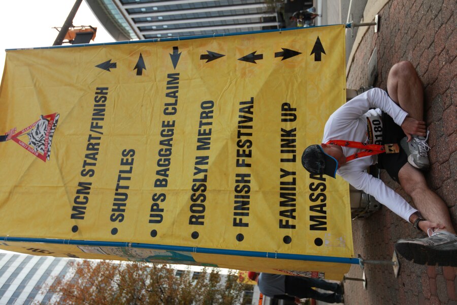 Petty Officer Third Class Travis Haley, a hospital corpsman with Chemical Biological Incident Response Force, Marine Forces North, stretches out after completing the annual Marine Corps Marathon. The marathon is one of several Haley will be running to raise money for the Wounded Warriors Project.