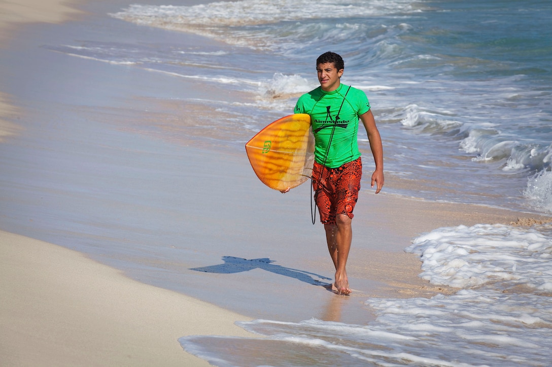 Tyler Williams emerges from the water off Pyramid Rock Beach following a heat in the Kuau Rockin’ Surf Competition on Marine Corps Base Hawaii, Oct. 31, 2010. Approximately 50 service members and civilians participated in the competition.
