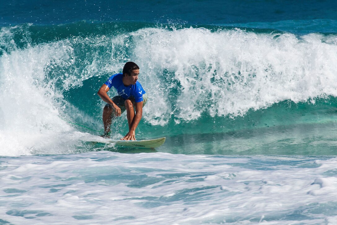 Sixteen-year-old competitor Justin Burbage catches a wave during the Kuau Rockin’ Surf Competition at Pyramid Rock Beach on Marine Corps Base Hawaii, Oct. 31, 2010. “It’s cool to have a chill surf session with the guys that are out there putting their lives on the line for our country,” said Burbage, of Kaneohe, Hawaii.