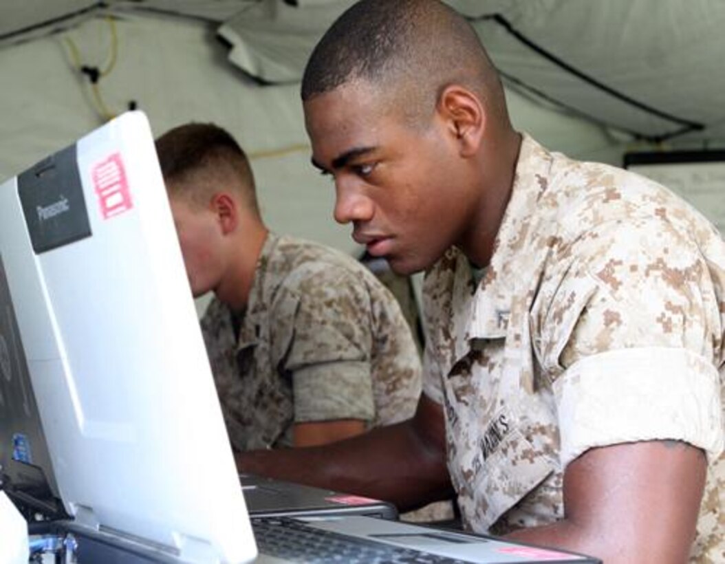 Marines from RCT-8 concentrate during their command and control exercise held at Marine Corps Base Camp Lejeune, N.C.  The exercise allowed the Marines to hone their skills for future deployments in support of Operation Enduring Freedom.