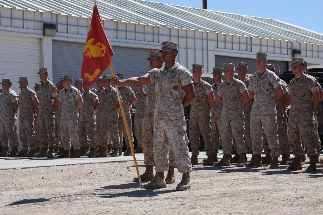 The 3rd Combat Engineer Battalion remain behind element waits in formation before Lance Cpl. Tiofilo Corona Jr. receives his Purple Heart Sept. 1. Corona sustained a broken foot after his vehicle was hit by an improvised explosive device in Afghanistan.