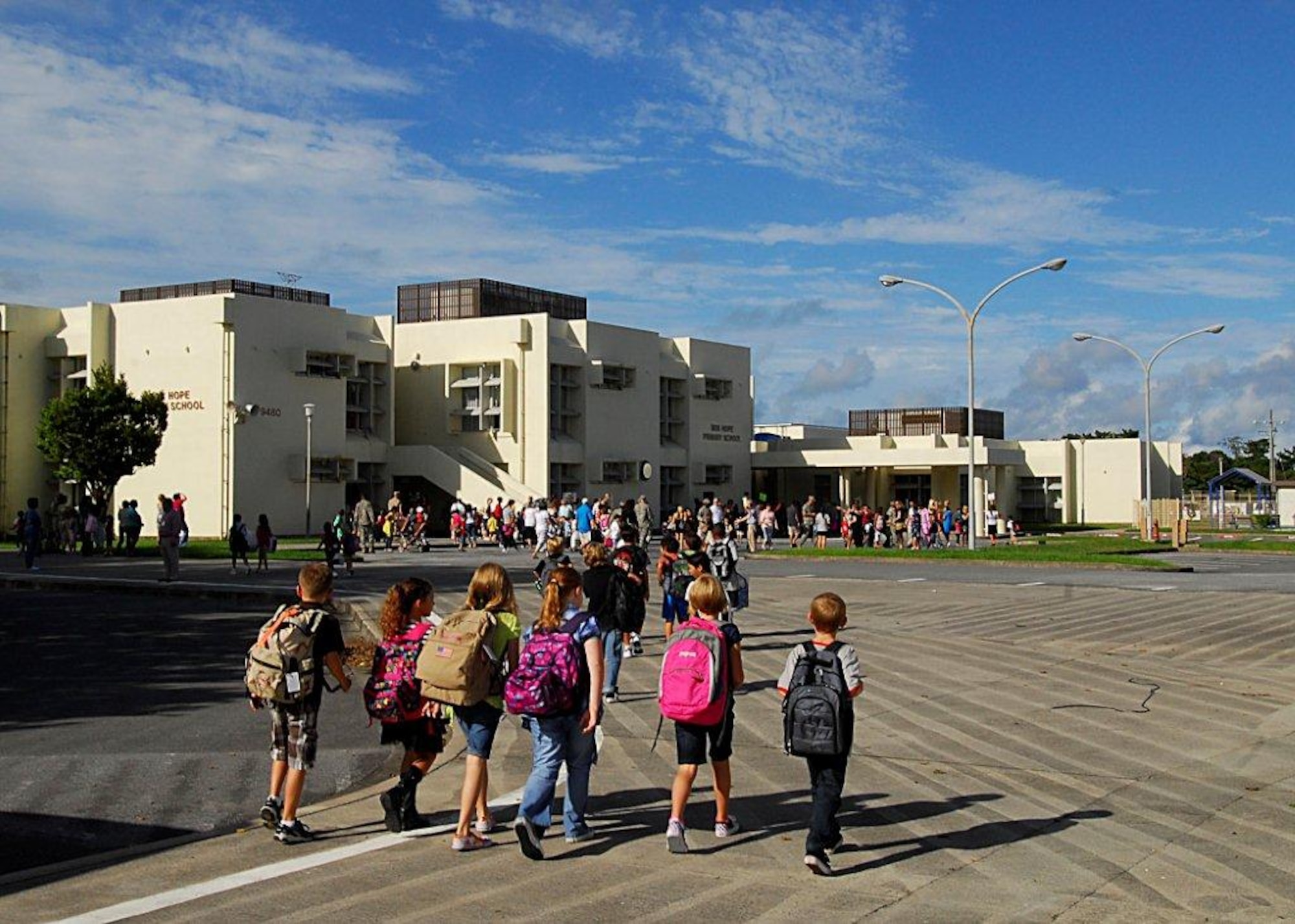 A group of children walk toward Bob Hope Primary School here for class Aug. 30, 2010. All DoDDS schools began with the common goal of increasing student achievement for everyone attending. (U.S. Air Force photo/Airman 1st Class Maeson L. Elleman) 