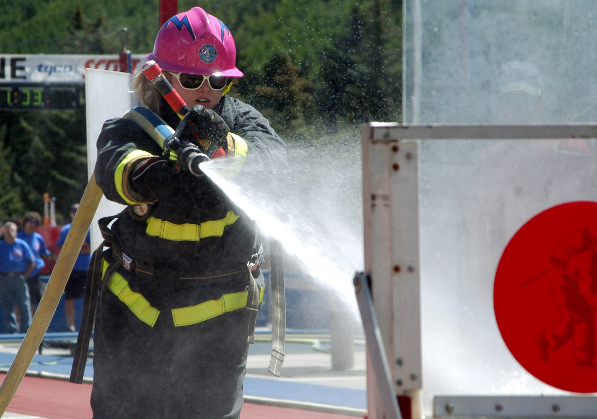 Senior Airman Jessica Morehouse competes as part of the Fire Fembots team at the Regional Firefighter Combat Challenge in Vail, Colo., Aug. 29, 2010. Airman Morehouse was named the Department of Defense's military firefighter of the year during the Fire and Emergency Services Annual Awards Banquet Aug. 27. (U.S. Air Force photo/John Van Winkle)