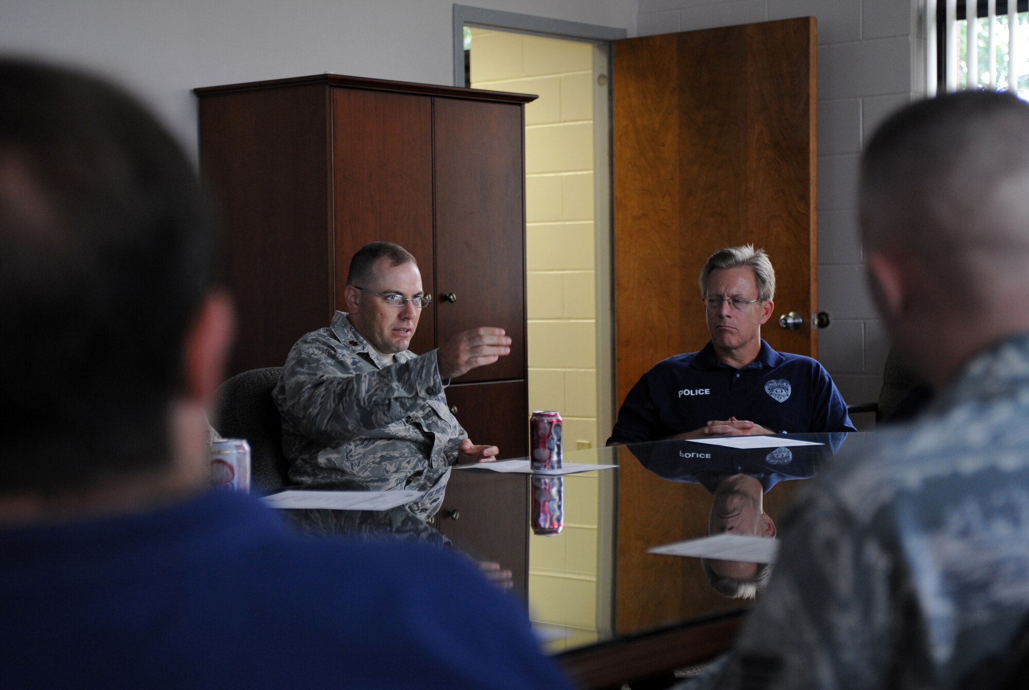 U.S. Air Force Maj. Christopher Sheffield, 1st Special Operations Security Forces Squadron commander converses with Darrell Bruhn, captain of the Fort Walton Beach Police Department, during a police department tour at Hurlburt Field, Fla., Aug. 27, 2010. The purpose of the tour was to share information and techniques in order to serve the community more efficiently. (DoD Photo by U.S. Air Force Airman Caitlin O’Neil-McKeown/Released)