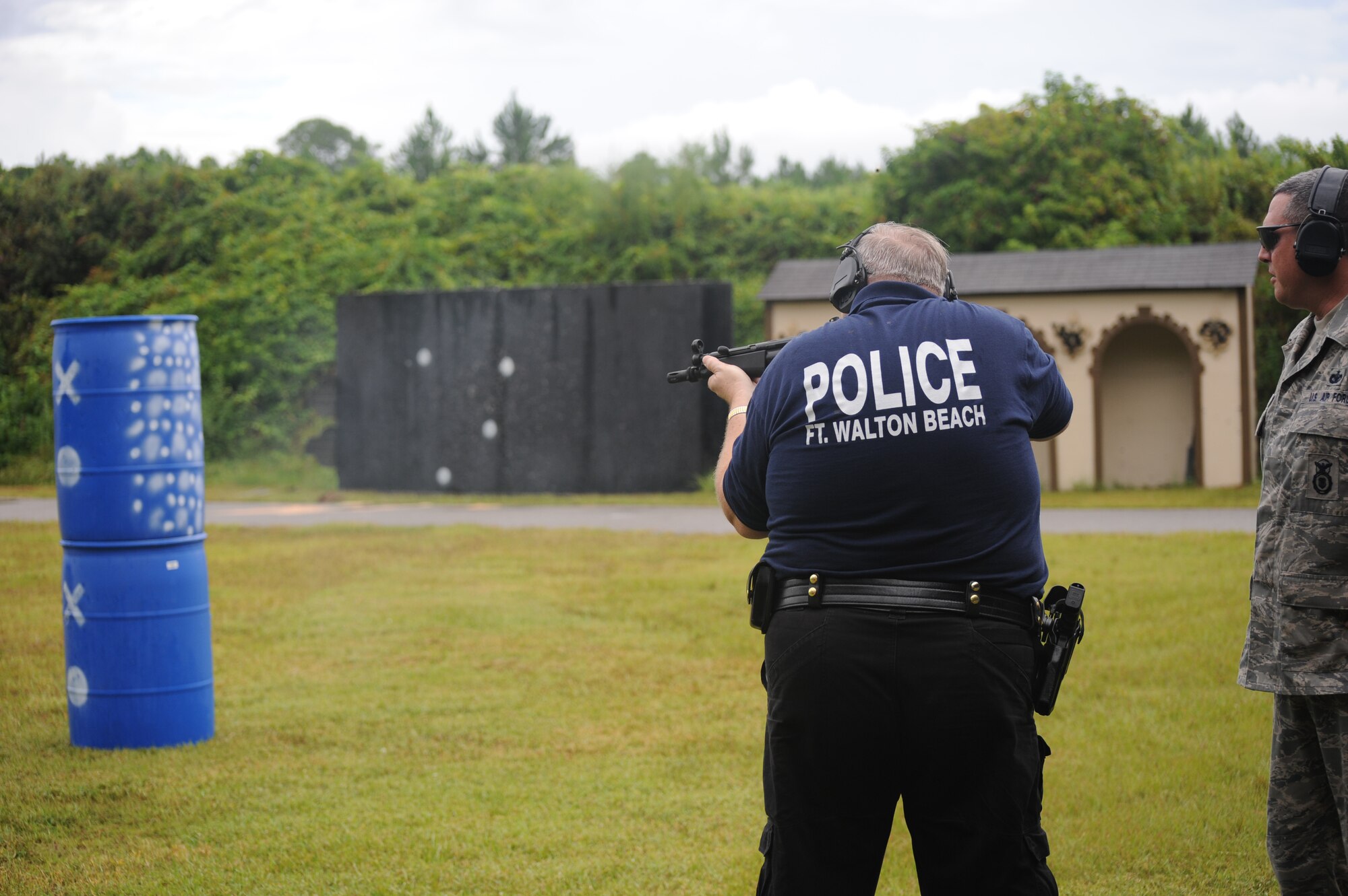 Ted Litshauer, Fort Walton Beach Police Department chief of police shoots a military weapon while on a tour at Hurlburt Field Fla., Aug. 27, 2010. The purpose of the tour was to share information and techniques in order to serve the community more efficiently. (DoD Photo by U.S. Air Force Airman Caitlin O’Neil-McKeown/Released)