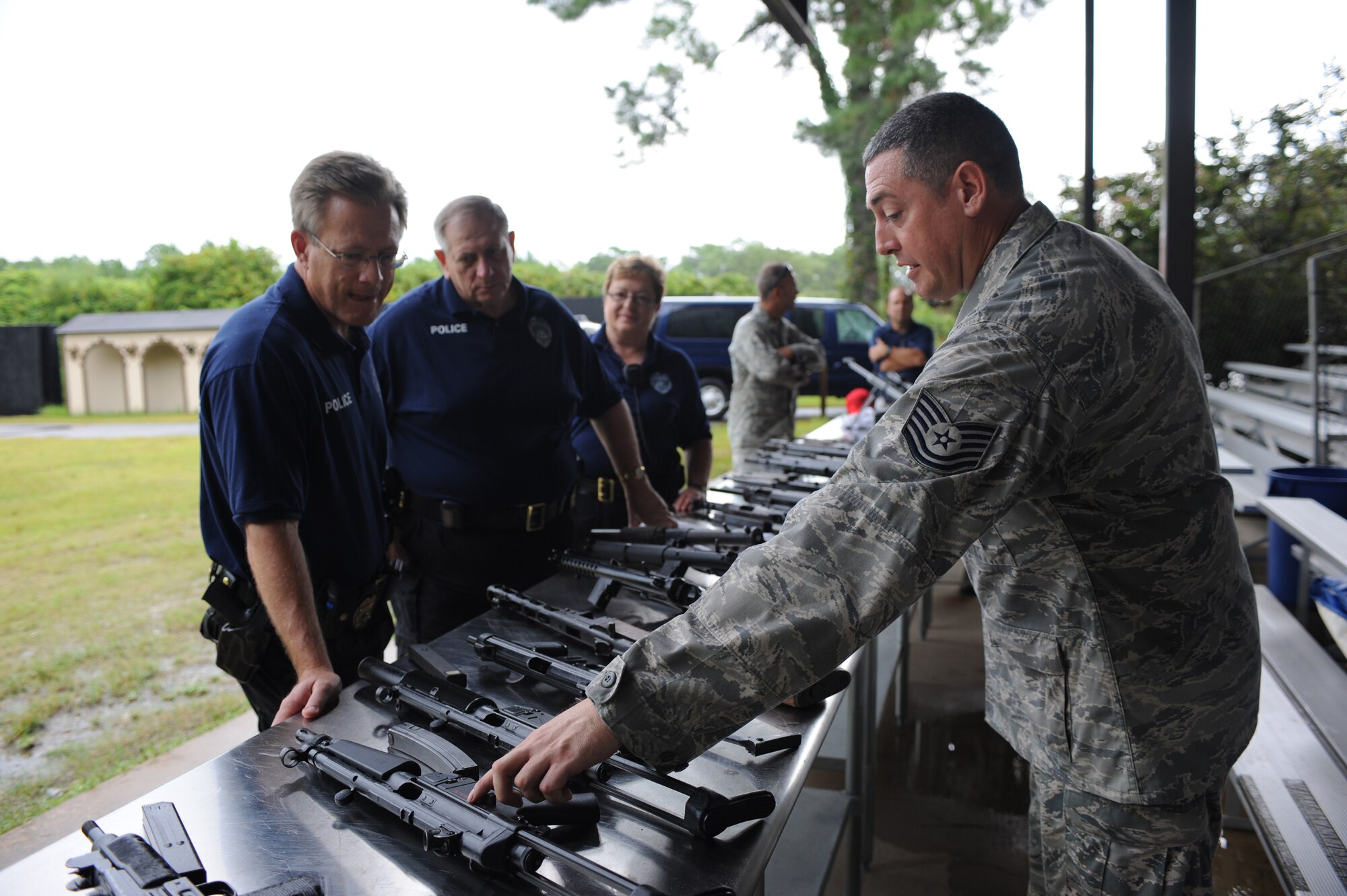 U.S. Air Force Tech. Sgt. Jason Slevin, U.S. Air Force Special Operations School force protection NCO in charge, exhibits and identifies different types of weapons for the Fort Walton Beach Police Department while on their tour at Hurlburt Field Fla., Aug. 27, 2010. The purpose of the tour was to share information and techniques in order to serve the community more efficiently. (DoD Photo by U.S. Air Force Airman Caitlin O’Neil-McKeown/Released)
