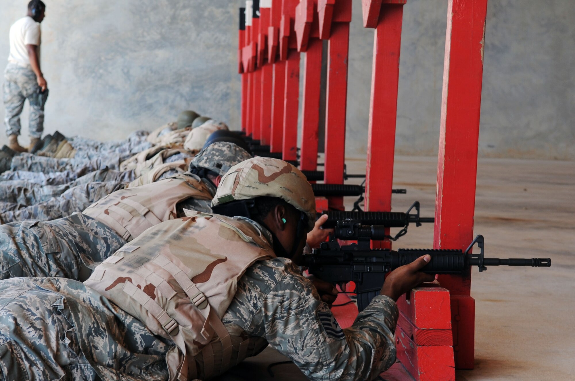 BARKSDALE AIR FORCE BASE, La. -- Airmen fire practice rounds during M-16A2 rifle qualifications Sept. 1. The M-16A2 is the primary weapon for Air Force enlisted combatant personnel. (U.S. Air Force photo by Senior Airman Brittany Y. Bateman)