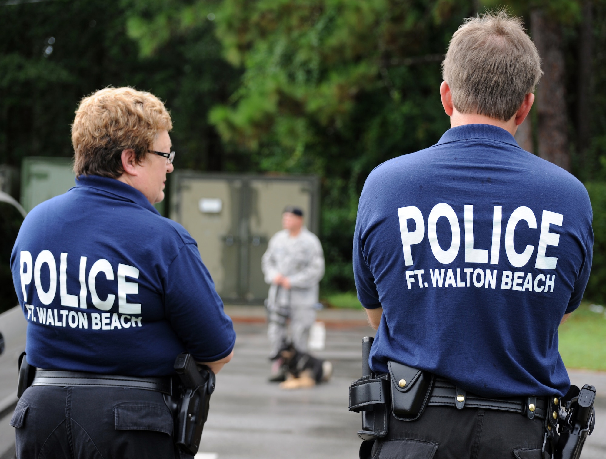 Members of the Fort Walton Beach Police Department watch a demonstration of the military working dogs and their handlers while on a tour at Hurlburt Field Fla., Aug. 27, 2010. The purpose of the tour was to share information and techniques in order to serve the community more efficiently. (DoD Photo by U.S. Air Force Airman Caitlin O’Neil-McKeown/Released)
