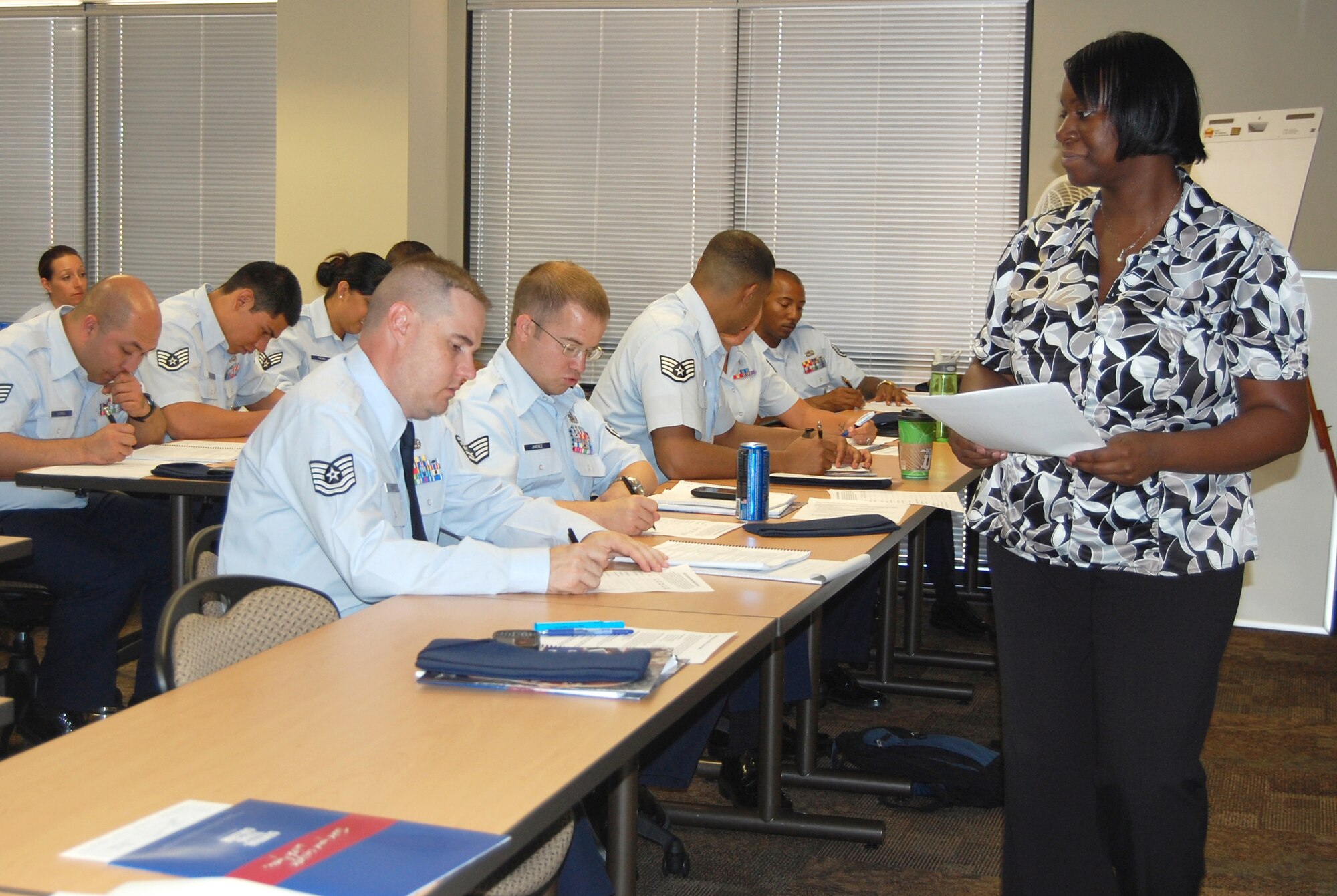 Shauna Madden, instructor with Central Texas College, explains to the class how to complete a worksheet as part of the NCO Leadership Development Course Aug. 9 in the 926th Group training classroom.