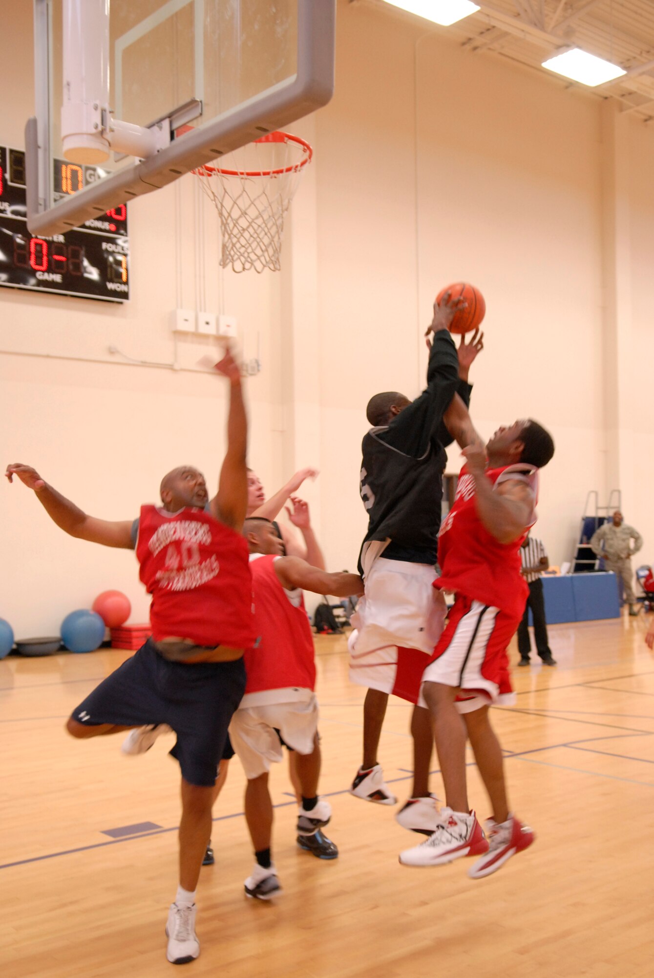 VANDENBERG AIR FORCE BASE, Calif. -- Members from the 30th Launch Group and 30th Civil Engineer Squadron reach for the ball during the over 30 intramural basketball league finals at the base fitness center here Monday, Aug. 30, 2010.  The 30th LCG team won 49-39.  (U.S. Air Force photo/Senior Airman Andrew Satran) 

 

 

 
 
 
 

 

 
 
 

 