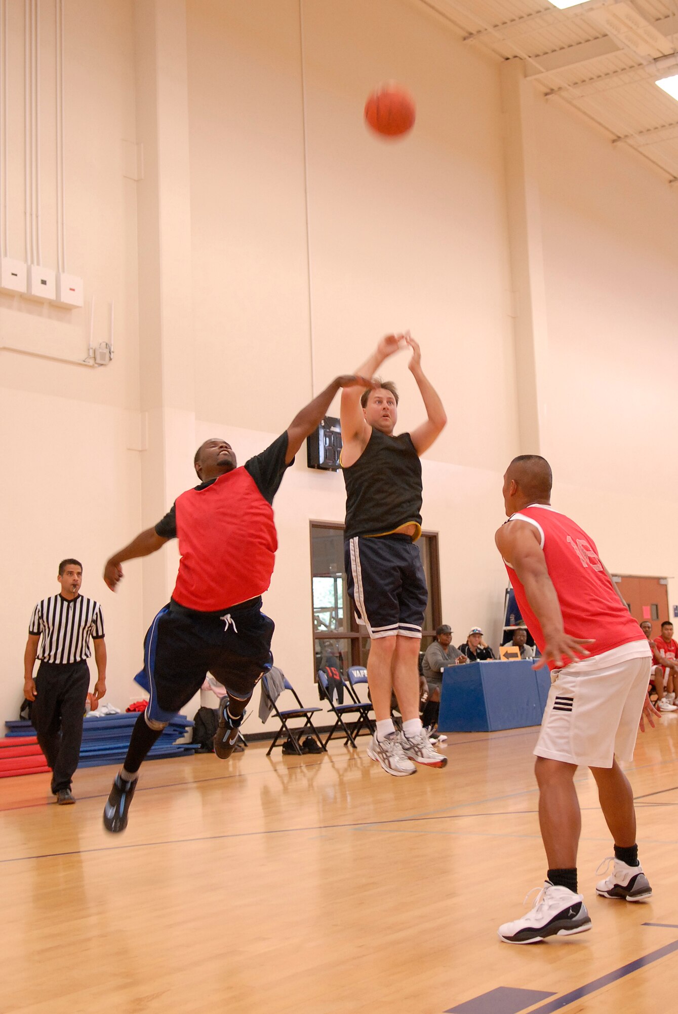 VANDENBERG AIR FORCE BASE, Calif. -- Leaping to shoot the ball, David Reedy, a 30th Launch Group team member, takes his shot during the over 30 intramural basketball league finals at the base fitness center here Monday, Aug. 30, 2010.  The 30th LCG team won 49-39.  (U.S. Air Force photo/Senior Airman Andrew Satran) 

 
 

 

 
 
 

 