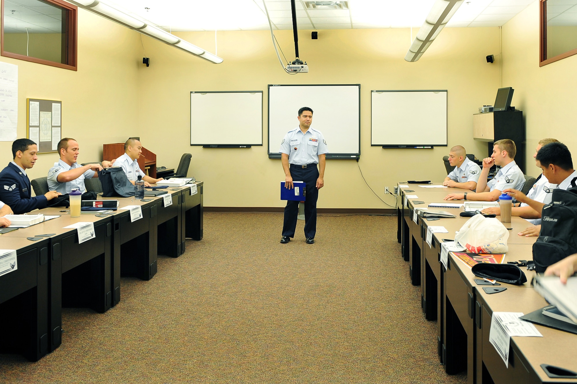 OFFUTT AIR FORCE BASE, Neb. - Staff Sgt. Brandon Matthes, 55th Force Support Squadron, gives his students instructions inside James M. McCoy Airman Leadership School June 28. Some of the topics covered throughout the five-week ALS course include time and stress management, the enlisted force structure, integrated operations, group dynamics and how to write an enlisted performance report. U.S. Air Force photo by Charles Haymond