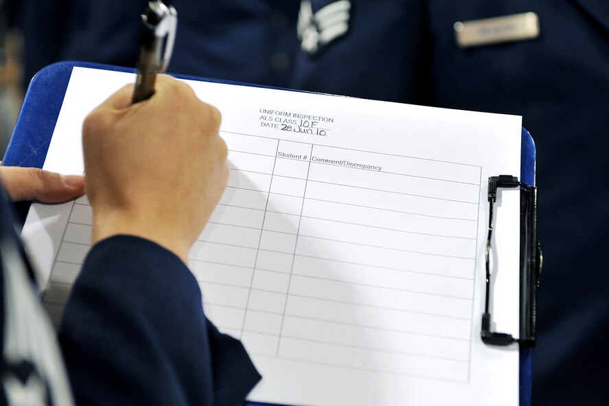 OFFUTT AIR FORCE BASE, Neb. - Staff Sgt. Kelly Miller, 55th Force Support Squadron, writes an airman leadership school inspection worksheet June 28 inside the James M. McCoy Airman Leadership School. Some of the topics covered throughout the five-week ALS course include time and stress management, the enlisted force structure, integrated operations, group dynamics and how to write an enlisted performance report. U.S. Air Force photo by Charles Haymond