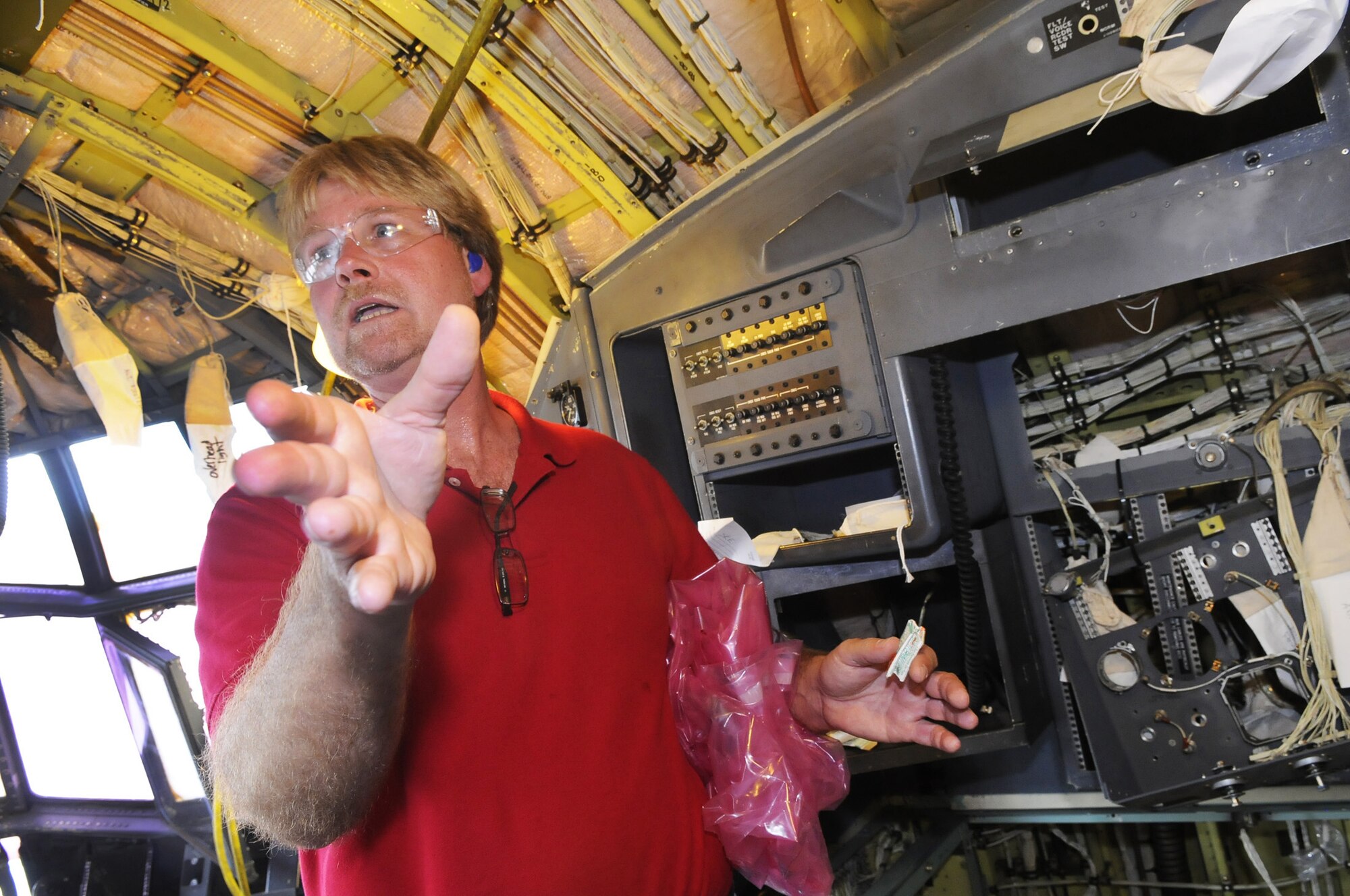 Randy Odell talks about upgrades to the cockpit of the first C-130 aircraft to enter into the Avionics Modernization Program at Robins. U. S. Air Force photo by Sue Sapp
