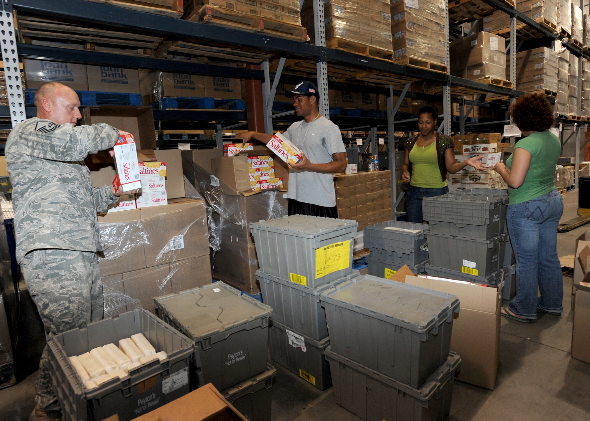 Airmen from McConnell’s Air Force Sergeants Association Chapter 972, pack food items at the Kansas Food Bank Aug. 27, 2010, Wichita, Kan.  The AFSA supported the food bank by collecting non-perishable food items during the month of August and assisting with the “Backpack for Kids” program that will provide food for local families.  AFSA is a non-profit organization representing the professional and personal interests of more than 130,000 active-duty, retired and veteran enlisted members of the U.S. Air Force and their family members.  (U.S. Air Force photo/Airman 1st Class Andrea Salazar)