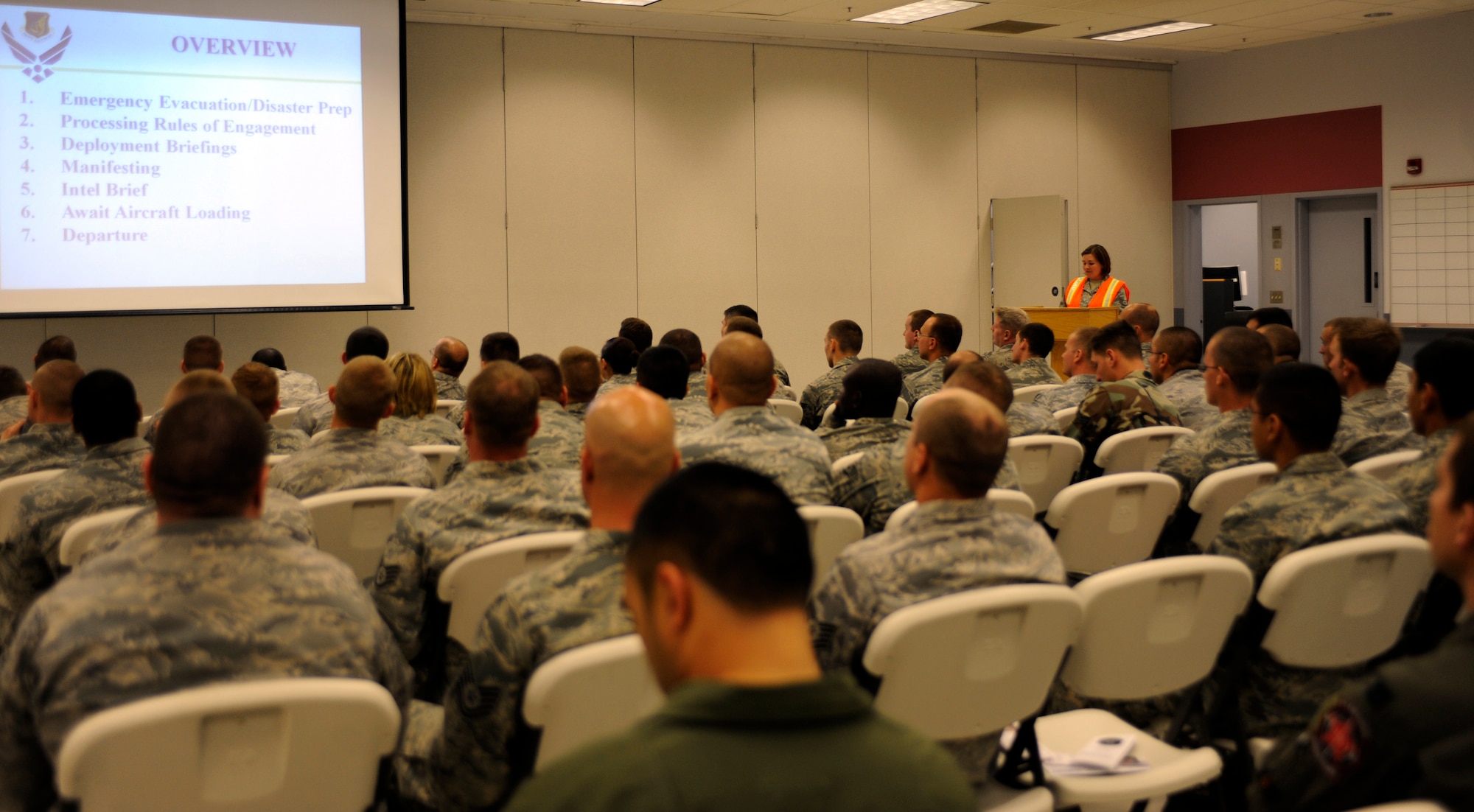 Airmen attend a deployment slideshow August 27, 2010, Eielson Air Force Base, Alaska. The slideshow was part of deployment out processing at the Joint Mobility Center. The Airmen are deploying in support of Valiant Shield in the south-east Asia region. (U.S. Air Force photo/Senior Airman Willard E. Grande II)