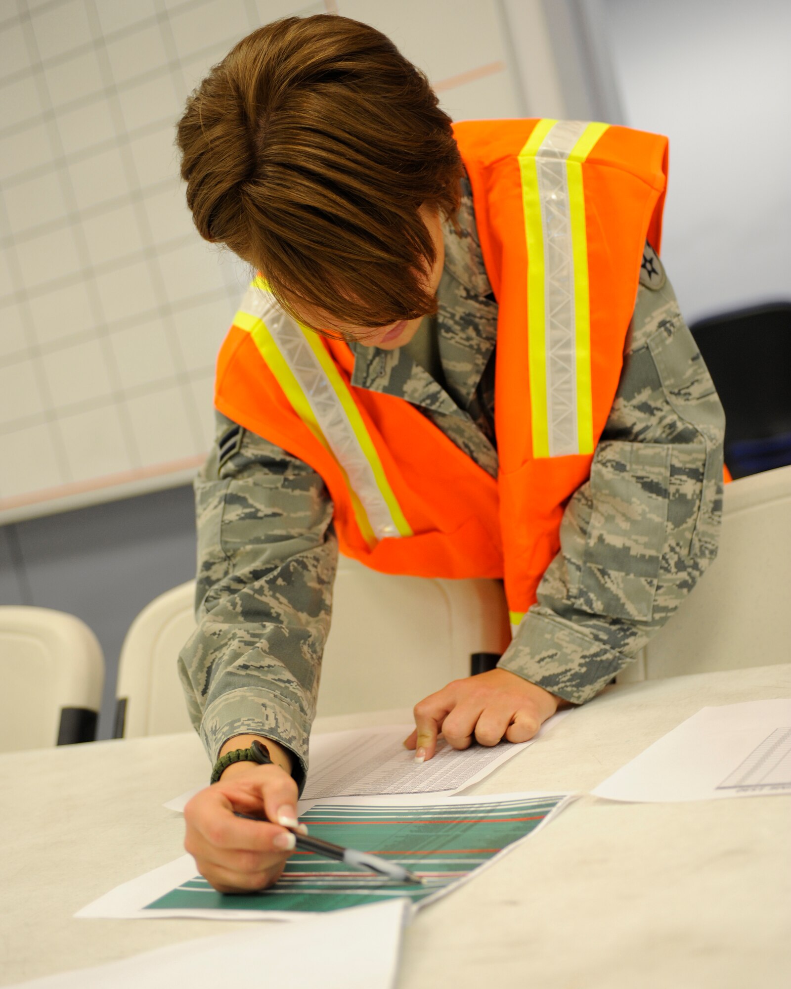 A representative from the 354th Medical Group ensures Airmen are cleared to deploy August 27, 2010, Eielson Air Force Base, Alaska. Representatives from certain units are available to deploying Airmen to take care of any unfinished pre-deployment business. The Airmen are deploying in support of Valiant Shield in the south-east Asia region. (U.S. Air Force photo/Senior Airman Willard E. Grande II)