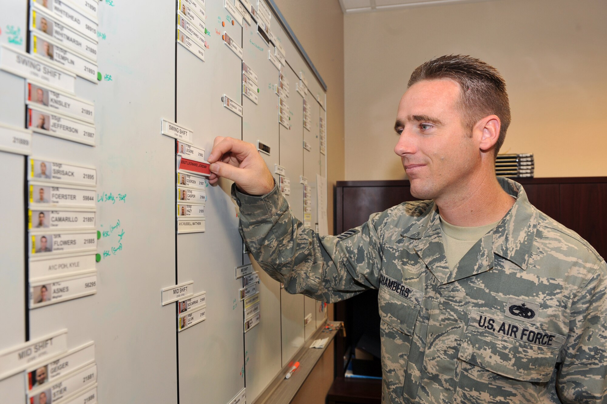 Tech. Sgt. Christopher Chambers, 314th Aircraft Maintenance Squadron specialist section chief, updates the Blue AMU specialist manning board Sept. 1. The Palm Springs, Calif., native was selected as the aircraft maintenance unit self inspection monitor and keeps the 314th AMXS on track for the upcoming unit compliance inspection. (U.S. Air Force photo by Staff Sgt. Chris Willis)
