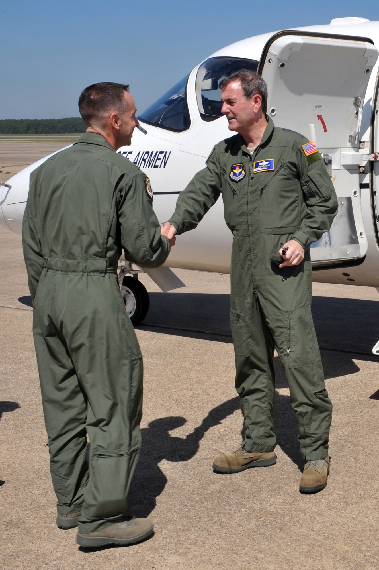 Col. Mark Czelusta (left), 314th Airlift Wing commander, welcomes Gen. Stephen Lorenz, Air Education and Training Command commander, Aug. 27 at the Little Rock Air Force Base flightline.  The 314th AW was among several of the AETC bases General Lorenz is visiting before his retirement later this year. (U.S. Air Force photo by Staff Sgt. Chris Willis)