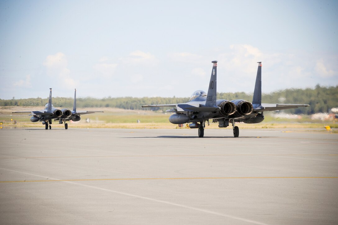Two F-15E Strike Eagles taxi the runway Aug. 25, 2010, at Joint Base Elmendorf-Richardson, Alaska.  The 391st Fighter Squadron out of Mountain Home Air Force Base, Idaho, is currently assigned to JB Elmendorf for a temporary duty assignment to aid in training exercises for the F-22 Raptor squadrons stationed here. (U.S. Air Force photo/Staff Sgt. Joshua Garcia)