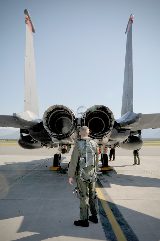 Capt. David Gunter inspects the exhaust of an F-15E Strike Eagle during pre-flight Aug. 25, 2010, at Joint Base Elmendorf-Richardson, Alaska. Captain Gunter and the F-15E Strike Eagles are assigned to the 391st Fighter Squadron out of Mountain Home Air Force Base, Idaho. (U.S. Air Force photo/Staff Sgt. Joshua Garcia)