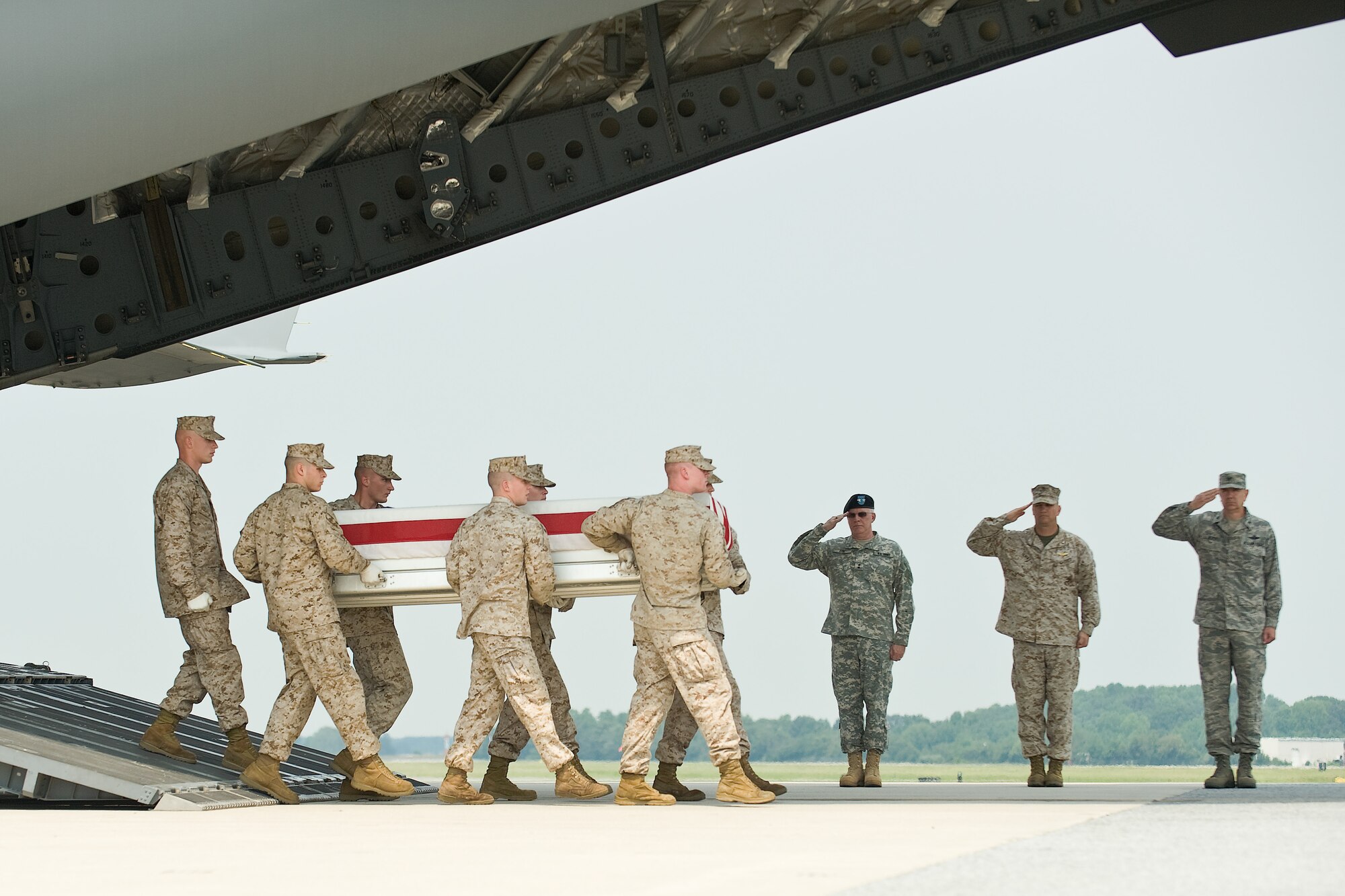 A U.S. Marine Corps team transfers the remains of Marine Corps Cpl. Christopher J. Boyd, of Palatine, Ill., at Dover Air Force Base, Del., August 21. Cpl. Boyd was assigned to 2nd Battalion, 4th Marine Regiment, 1st Marine Division, I Marine Expeditionary Force, Camp Pendleton, Calif.  (U.S. Air Force photo/Roland Balik)