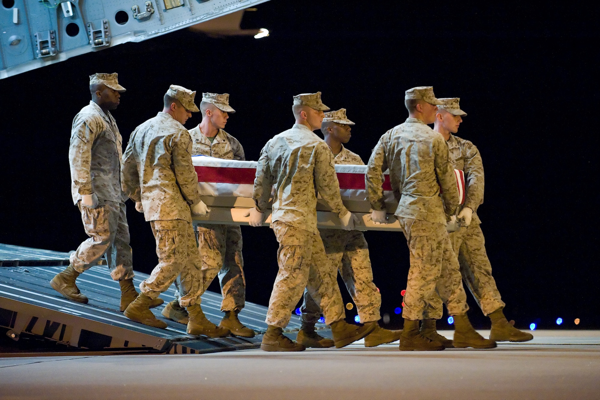 A U.S. Marine Corps team transfers the remains of Marine Corps Pfc. Vincent E. Gammone III, of Christiana, Tenn., at Dover Air Force Base, Del., August 9. Pfc. Gammone was assigned to 1st Battalion, 2nd Marine Regiment, 2nd Marine Division, II Marine Expeditionary Force, Camp Lejeune, N.C.  (U.S. Air Force photo/Roland Balik)