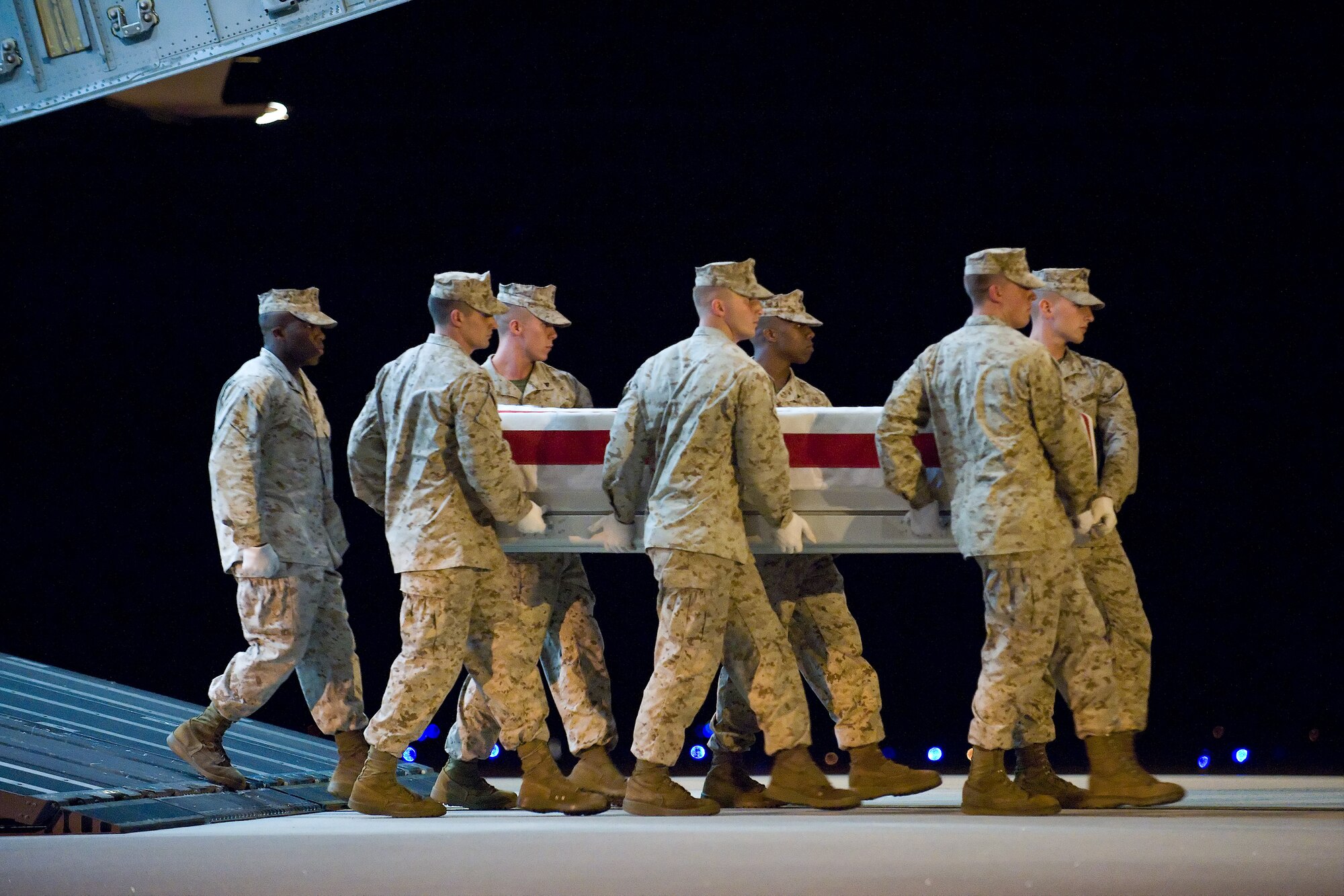 A U.S. Marine Corps team transfers the remains of Marine Corps Cpl. Kevin M. Cornelius, of Ashtabula, Ohio., at Dover Air Force Base, Del., August 9. Cpl. Cornelius was assigned to 1st Battalion, 2nd Marine Regiment, 2nd Marine Division, II Marine Expeditionary Force, Camp Lejeune, N.C.  (U.S. Air Force photo/Roland Balik)
