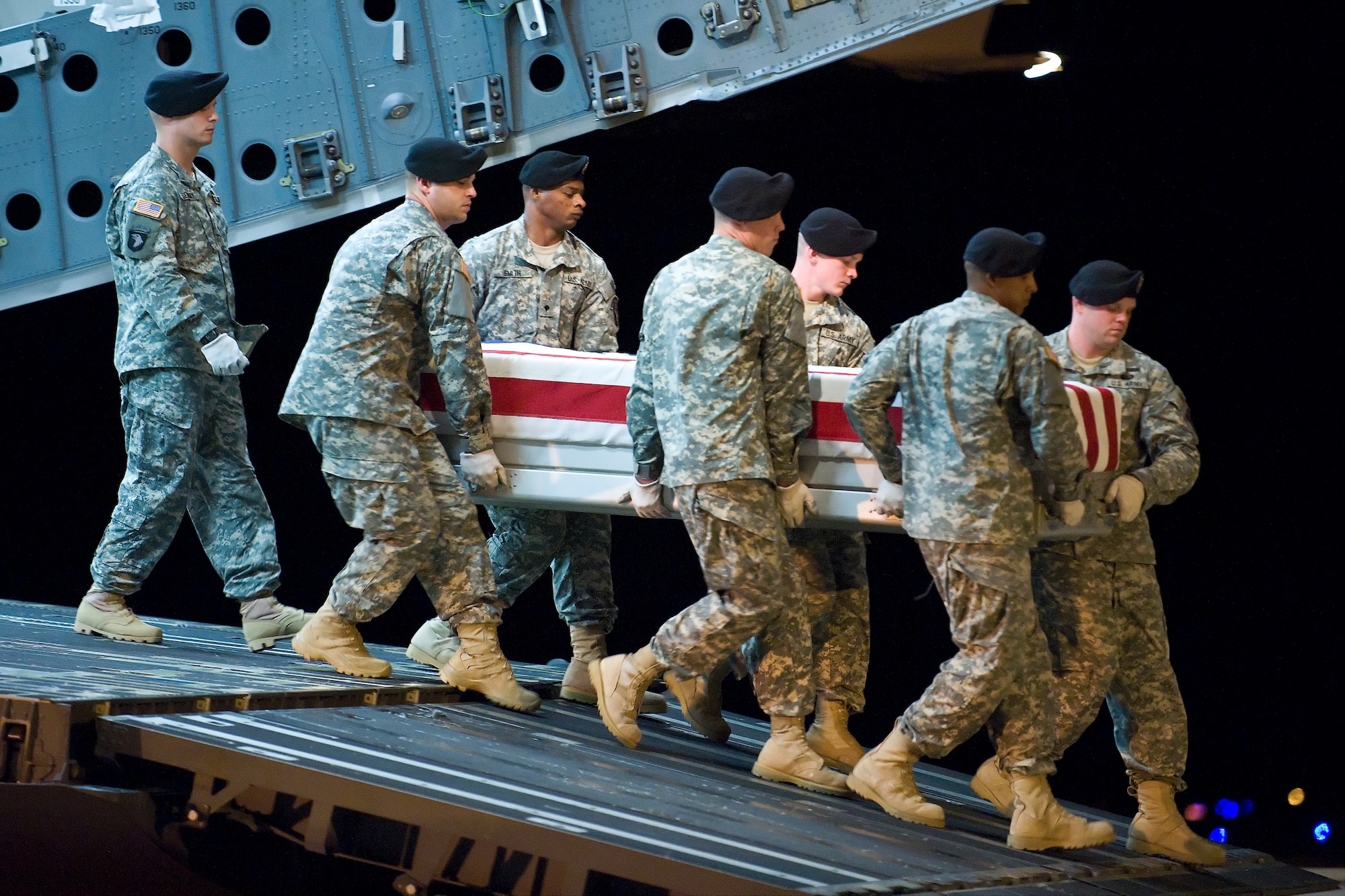 A U.S. Army carry team transfers the remains of Army Pfc. Bradley D. Rappuhn, of Grand Ledge, Mich., at Dover Air Force Base, Del., August 9. Pfc. Rappuhn was assigned to the 3rd Battalion, 75th Ranger Regiment, Fort Benning, Ga. (U.S. Air Force photo/Roland Balik)