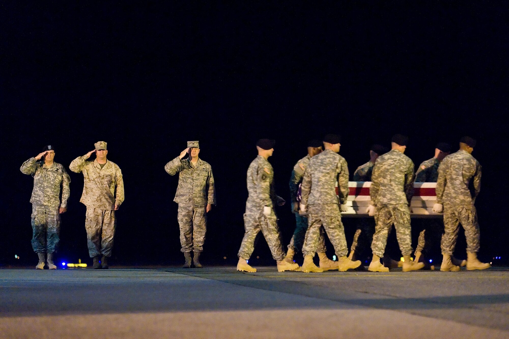 A U.S. Army carry team transfers the remains of Army Pfc. Paul O. Cuzzupe, of Plant City, Fla., at Dover Air Force Base, Del., August 9. Pfc. Cuzzupe was assigned to the 3rd Squadron, 2nd Stryker Calvary Regiment, Vilseck, Germany. (U.S. Air Force photo/Roland Balik)