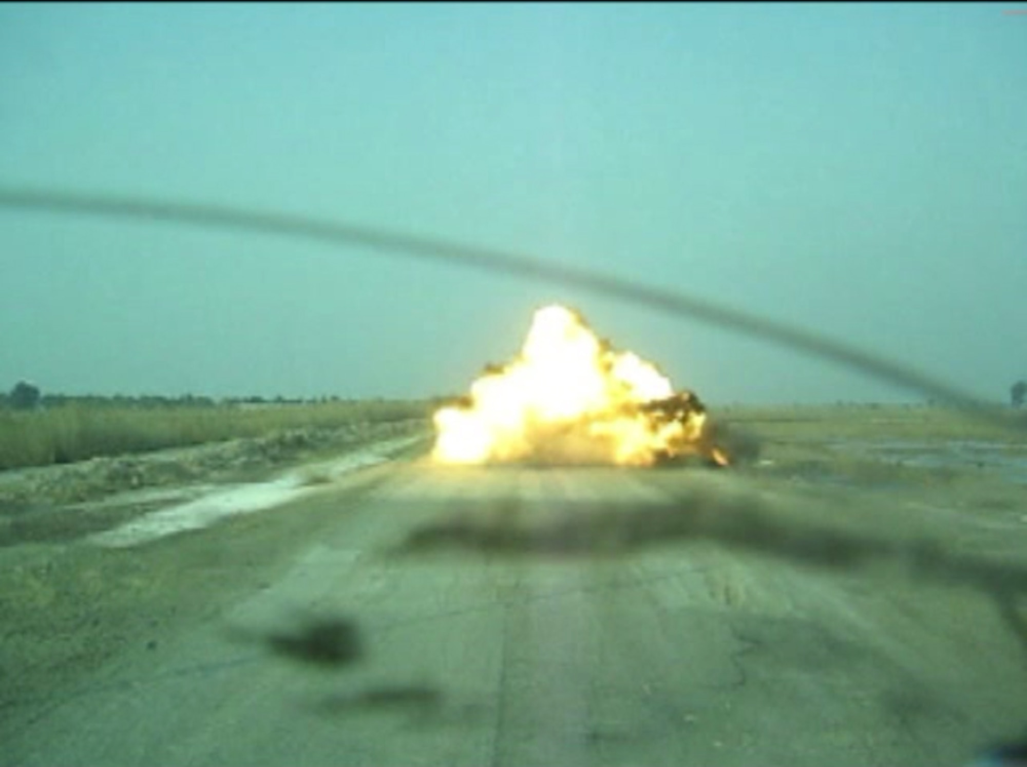Technical Sgt. Peter Arbelo, 87th Civil Engineer Squadron explosive ordnance disposal technician, took this photo of an explosion caused by an improvised explosive device detonated by a robot in Afghanistan. The team often uses robots to gather information on and detonate IEDs to help ensure the safety of deployed servicemembers and Afghan civilians in the area. (Courtesy photo)