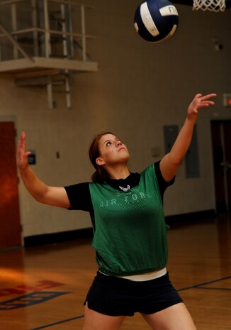 Sebastiana Solis-Lopez winds up for a serve against the 628th Communications Squadron in the first round of the intramural volleyball championship playoffs at the Fitness and Sports Center on Joint Base Charleston, S.C., Aug. 31, 2010. In the best-out-of-three series, the 437th Aircraft Maintenance Squadron defeated the 628 CS in the first two games. With the win, 437 AMXS will now challenge the 437th Aerial Port Squadron in the next round of games. Solis-Lopez is with the 437 AMXS. (U.S. Air Force photo/Airman 1st Class Lauren Main)