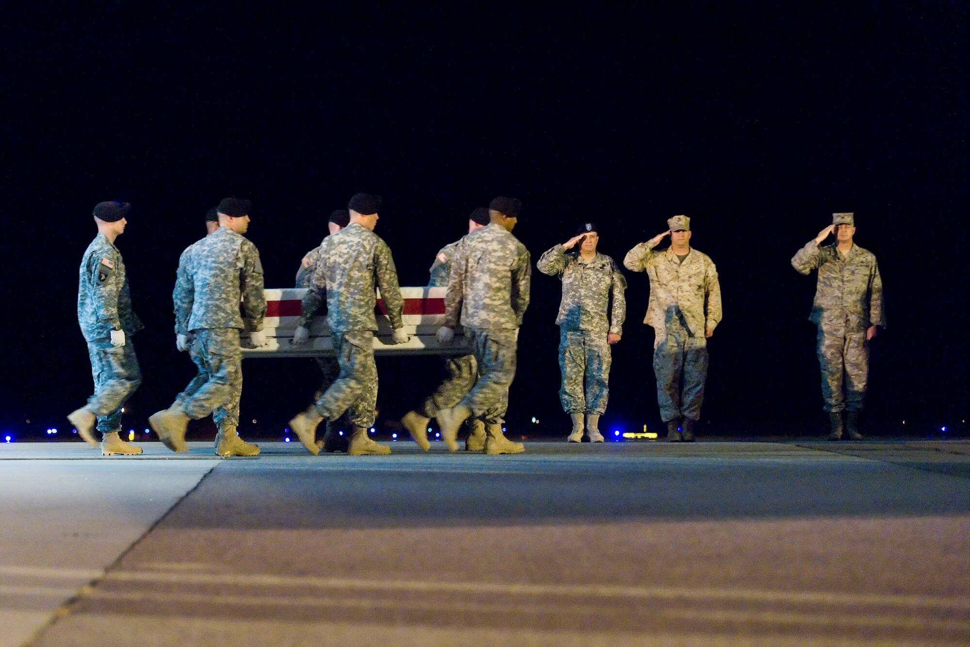 A U.S. Army carry team transfers the remains of Army Spc. Faith R. Hinkley, of Colorado Springs, Colo., at Dover Air Force Base, Del., August 9. Spc. Hinkley was assigned to the 502nd Military Intelligence Battalion, 201st Battlefield Surveillance Brigade, Joint Base Lewis-McChord, Wash.  (U.S. Air Force photo/Roland Balik)