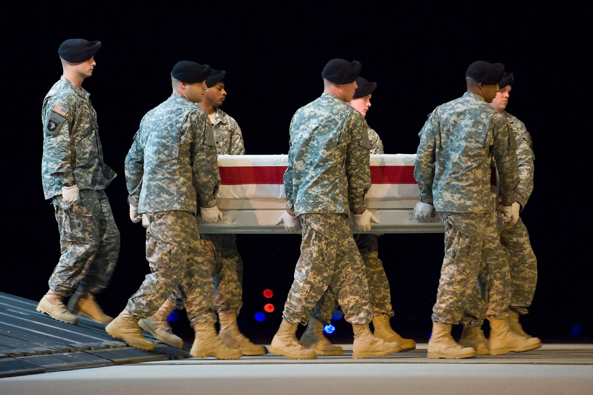 A U.S. Army carry team transfers the remains of Army Sgt. Andrew C. Nicol, of Kensington, N.H., at Dover Air Force Base, Del., August 9. Sgt. Nicol was assigned to the 3rd Battalion, 75th Ranger Regiment, Fort Benning, Ga.  (U.S. Air Force photo/Roland Balik)