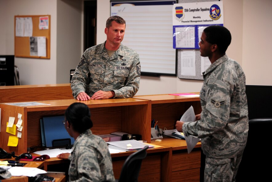 OFFUTT AIR FORCE BASE, Neb. - Master Sgt. Justin King, first sergeant for the 55th Wing staff, meets with Airman 1st Class Darrius Denkins, a financial analyst with the 55th Comptroller Squadron, as part of his daily rounds, Aug. 25.  Sergeant King handles many administrative duties and administers corrective actions when necessary to members under the commander's authority.U.S. Air Force photo by Josh Plueger