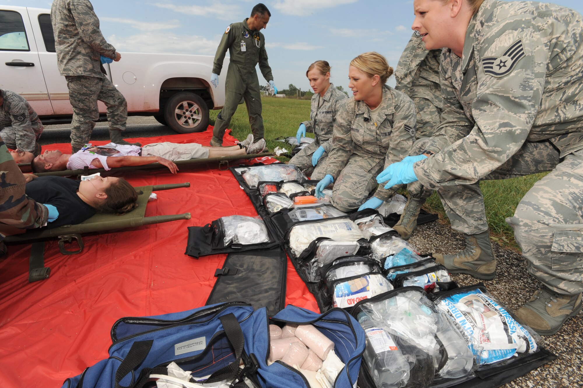 WHITEMAN AIR FORCE BASE, Mo. - Members of the 509th Medical Group, respond to simulated victims during a major accident response exercise here, Aug.31. Whiteman conducted a MARE to prepare for the upcoming Wings Over Whiteman Air Show and Open House Scheduled for Sept. 18 and 19. (U.S. Air Force photo by Senior Airman Carlin Leslie)

