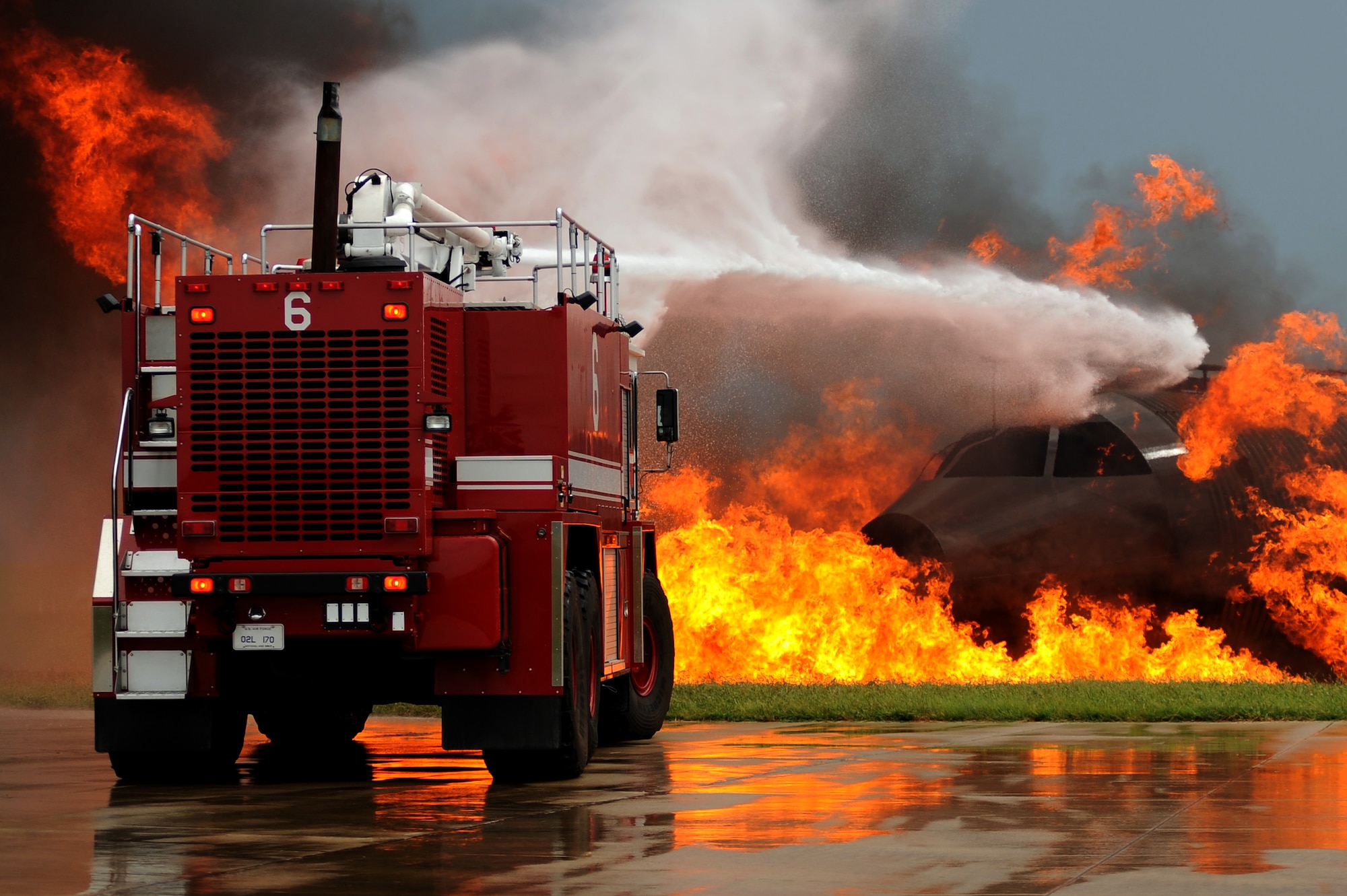 Firefighters from the 509th Civil Engineer Squadron move their fire engine
into position to extinguish a simulated aircraft fire during a major accident
response exercise, Aug. 31 at Whiteman Air Force Base, Mo. Firefighters and
other emergency response personnel conducted the MARE to prepare for any
mishaps that may occur during the Wings Over Whiteman Air Show and Open House scheduled to take place Sept. 18 and 19. (U.S. Air Force photo by
Senior Airman Kenny Holston)(Released)


