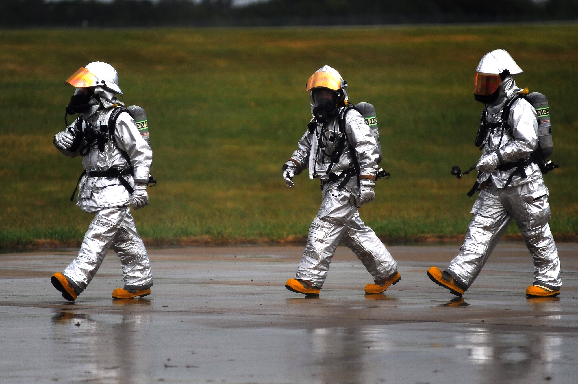 Firefighters from the 509th Civil Engineer Squadron prepare for a major accident response exercise, Aug. 31 at Whiteman Air Force Base, Mo. Firefighters and other emergency response personnel conducted a MARE to prepare for any mishaps that may occur during the Wings Over Whiteman Air Show and Open House scheduled to take place Sept. 18 and 19. (U.S. Air Force photo by Senior Airman Kenny Holston)(Released)
