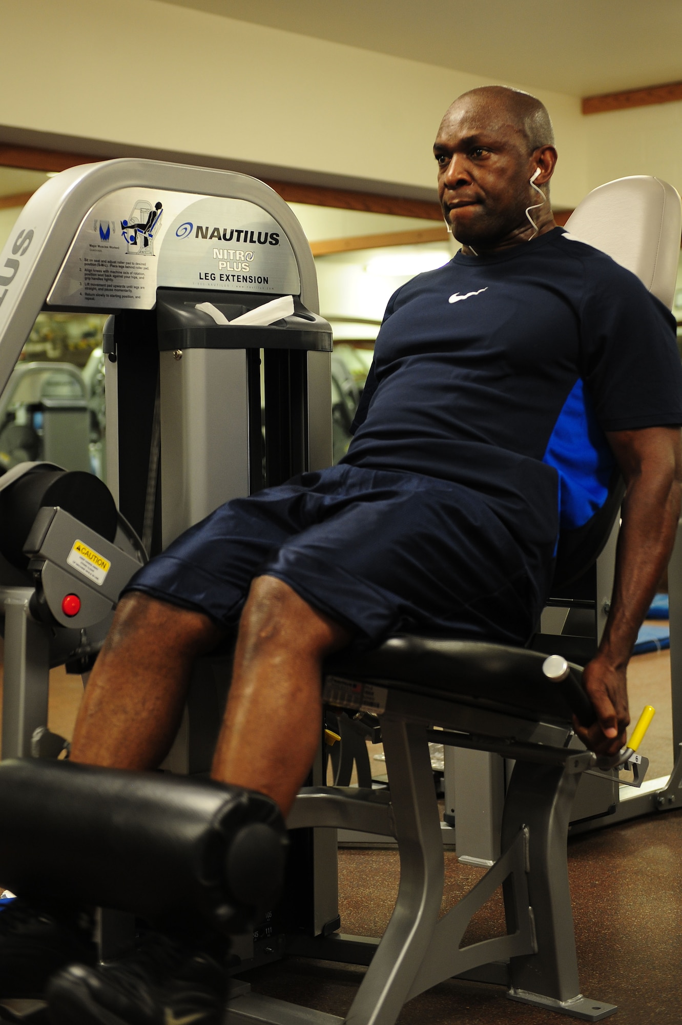 ELLSWORTH AIR FORCE BASE, S.D. – Chief Master Sgt. Clifton Cole, 28th Bomb Wing command chief, performs leg extensions, Aug. 17. Chief Cole serves as the principal senior advisor to Col. Jeffrey Taliaferro, 28th Bomb Wing commander. (U.S. Air Force photo/Senior Airman Corey Hook)  