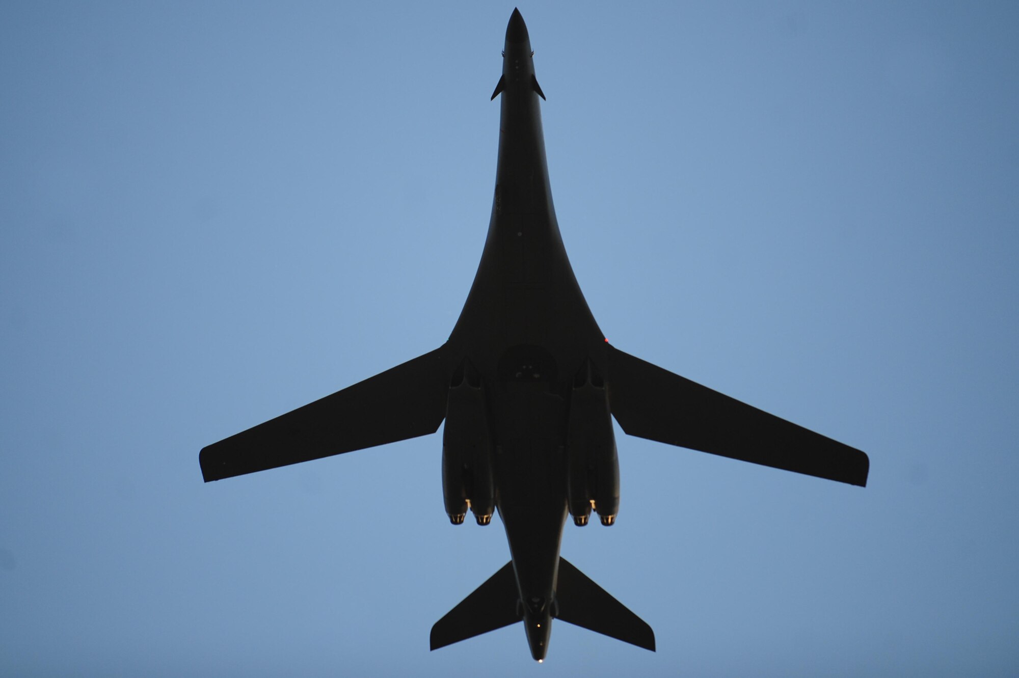 A B-1B Lancer performs a flyover during military appreciation day at the Central States Fair Professional Rodeo Cowboys Association Range Days Rodeo in Rapid City, S.D., Aug. 26. Along with the flyover, a presentation by the base honor guard was a key military feature to the night. (U.S. Air Force photo/Senior Airman Corey Hook)