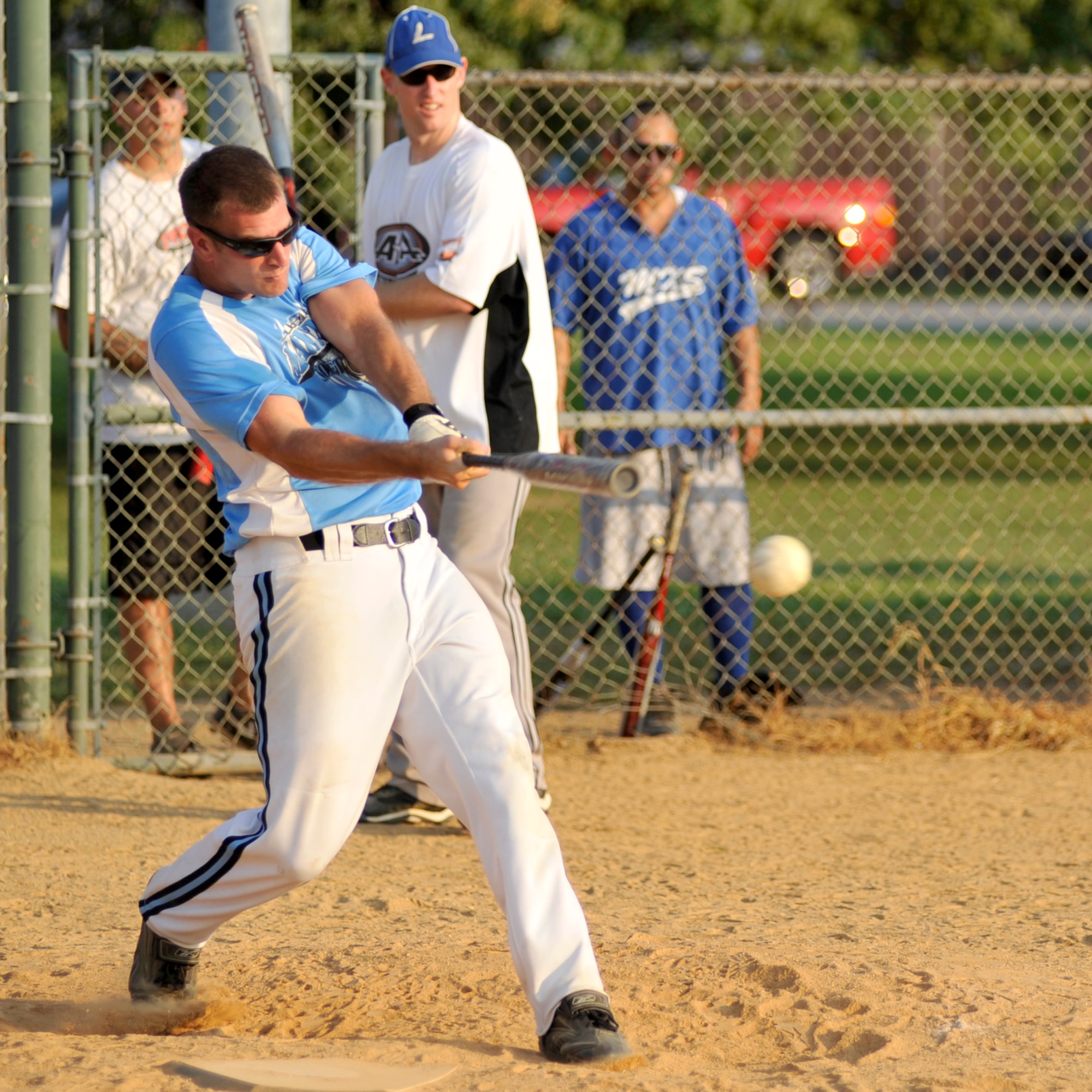 Jim Goerss, 436th Maintenance Squadron left fielder, blasts a base hit during an intramural softball playoff game against the 436th Security Forces Squadron at the base softball field on Dover Air Force Base, Del., Aug. 31, 2010. MXS moved on to its third championship game in a row as it held off the Cops 11-10. (U.S. Air Force photo by Tech. Sgt. Chuck Walker/Released)