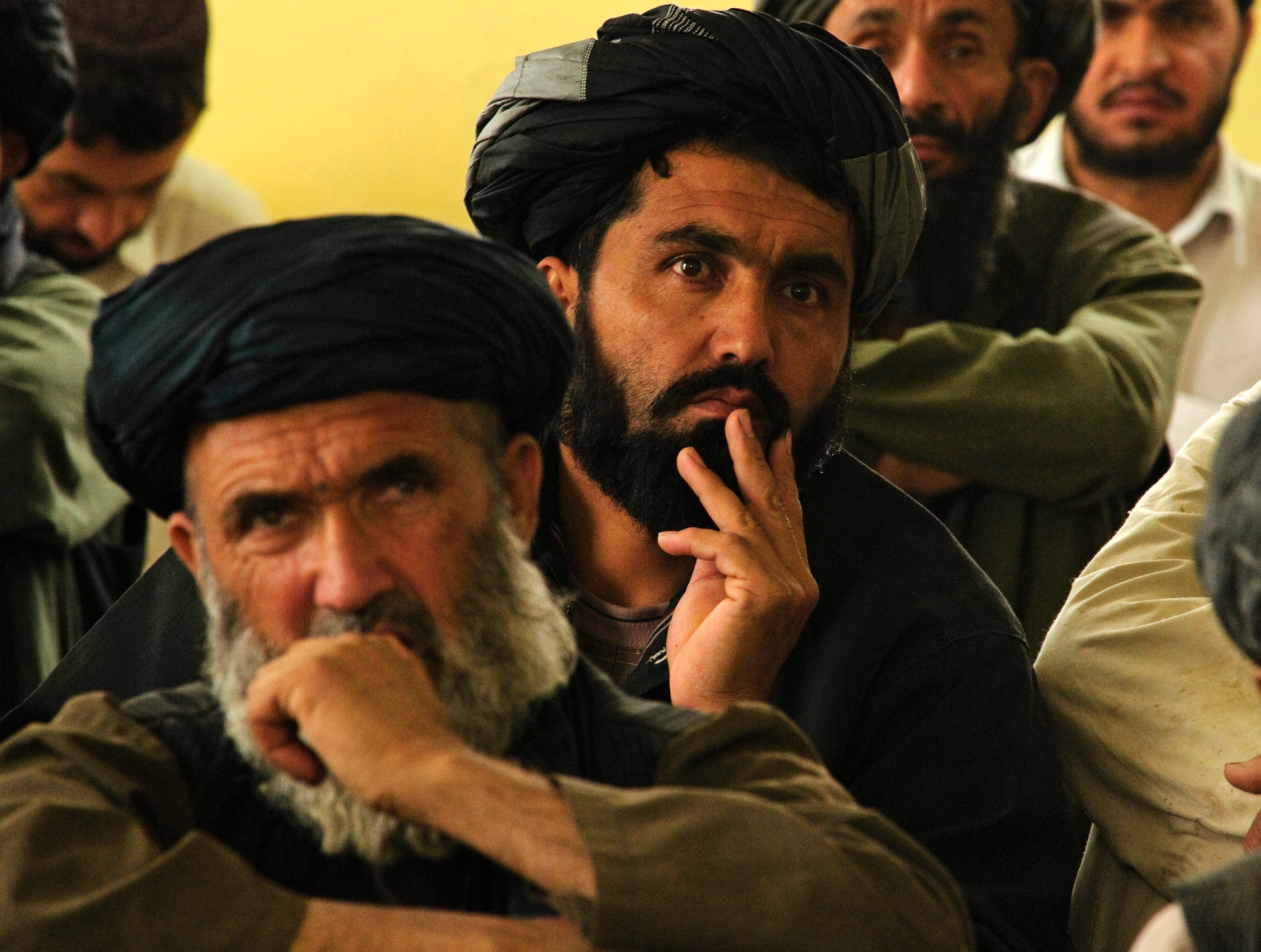 COMBAT OUTPOST MIZAN, Afghanistan - Afghan elders listen to district officials during a shura at the Mizan District Center, Mizan District, Zabul province, Aug. 28. Mizan District officials invited local elders to the shura to discuss the upcoming provincial parliamentary elections and vote on a district manager. (U.S. Air Force Photo/Senior Airmen Nathanael Callon/Released) 