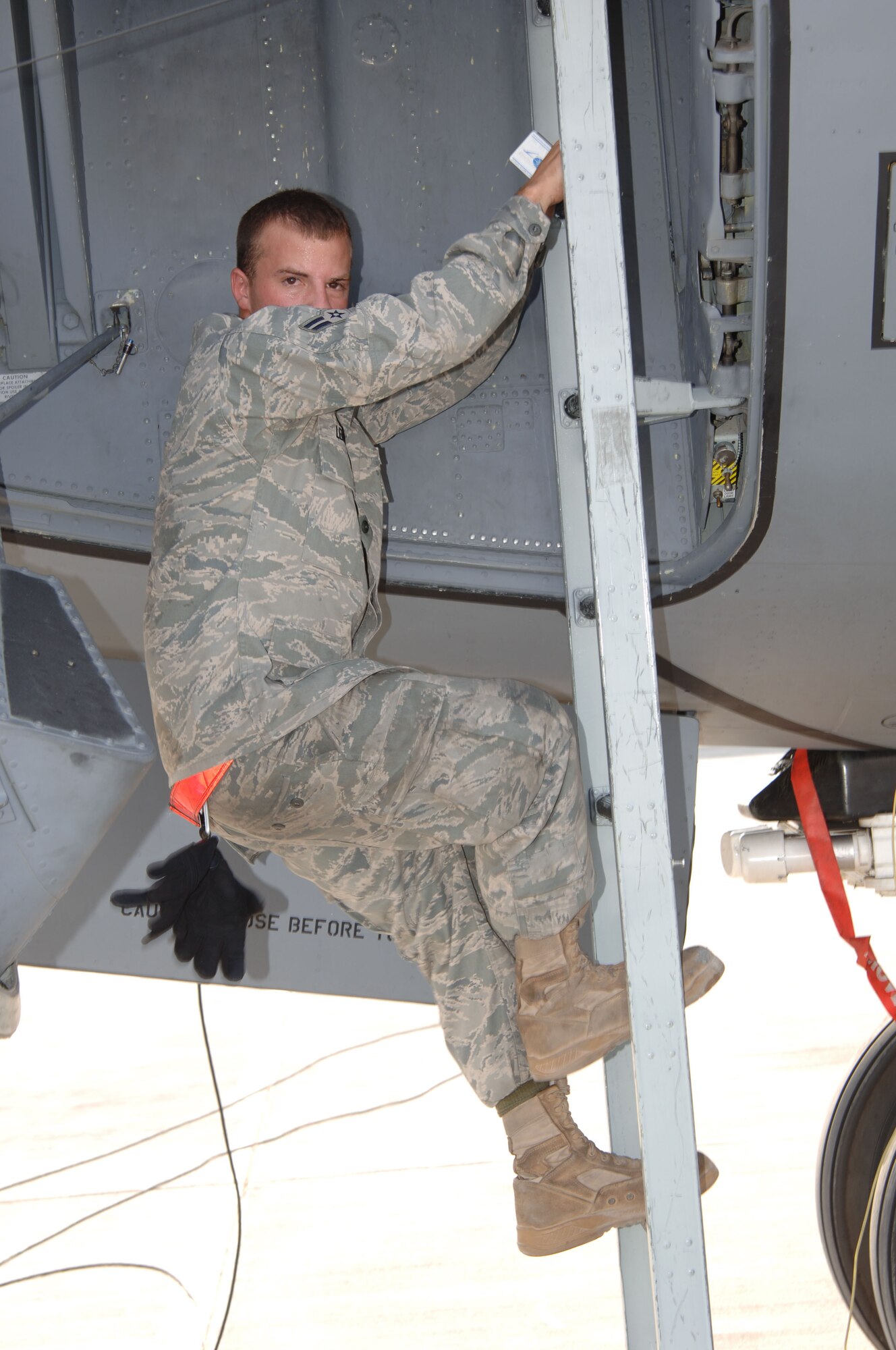 SOUTHWEST ASIA -  Airman 1st Class Michael Lengyel, 379th Expeditionary Aircraft Maintenance Squadron, exits a KC-135 Stratotanker Sept. 1, 2010 at an undisclose location after performing post flight maintenance.  The aircraft, flown by 340th Expeditionary Air Refueling Squadron Airmen, completed their last mission of operation IRAQI FREEDOM and the first of operation NEW DAWN. (U.S. Air Force photo/Tech. Sgt. Kimberly Spinner)