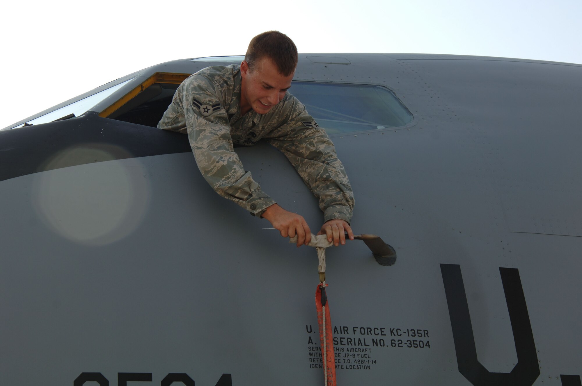 SOUTHWEST ASIA -  Airman 1st Class Michael Lengyel, 379th Expeditionary Aircraft Maintenance Squadron, covers a pito on a KC-135 Stratotanker Sept. 1, 2010 at an undisclose location. The aircraft, flown by 340th Expeditionary Air Refueling Squadron Airmen, completed their last mission of operation IRAQI FREEDOM and the first of operation NEW DAWN. (U.S. Air Force photo/Tech. Sgt. Kimberly Spinner) [RELEASED]