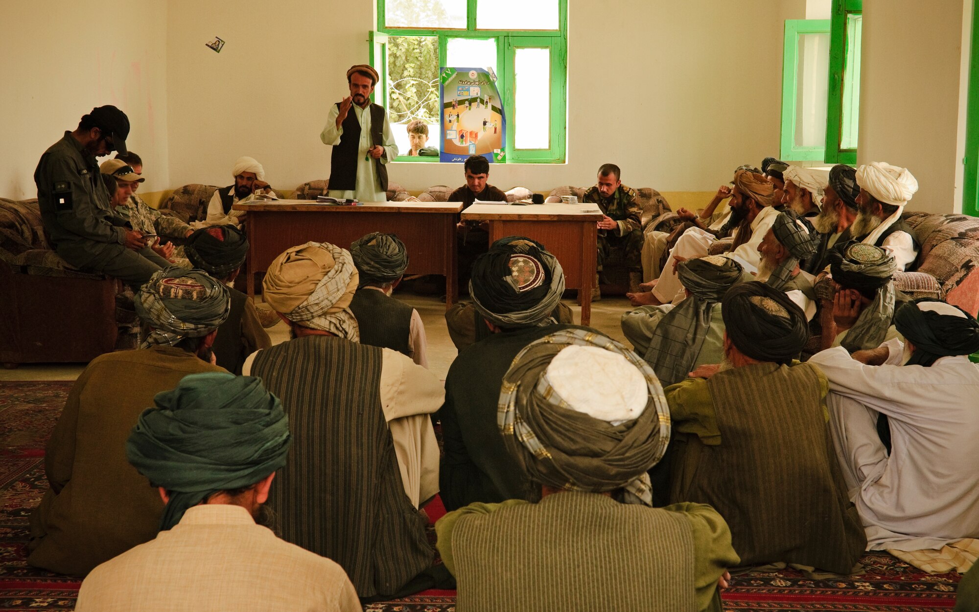 COMBAT OUTPOST MIZAN, Afghanistan - Noor Mohammed, Mizan District chief, speaks to local elders during a shura at the Mizan District Center, Mizan District, Zabul province, Aug. 28. Mizan District officials invited local elders to the shura to discuss the upcoming provincial parliamentary elections and vote on a district manager. (U.S. Air Force Photo/Senior Airman Nathanael Callon/Released)