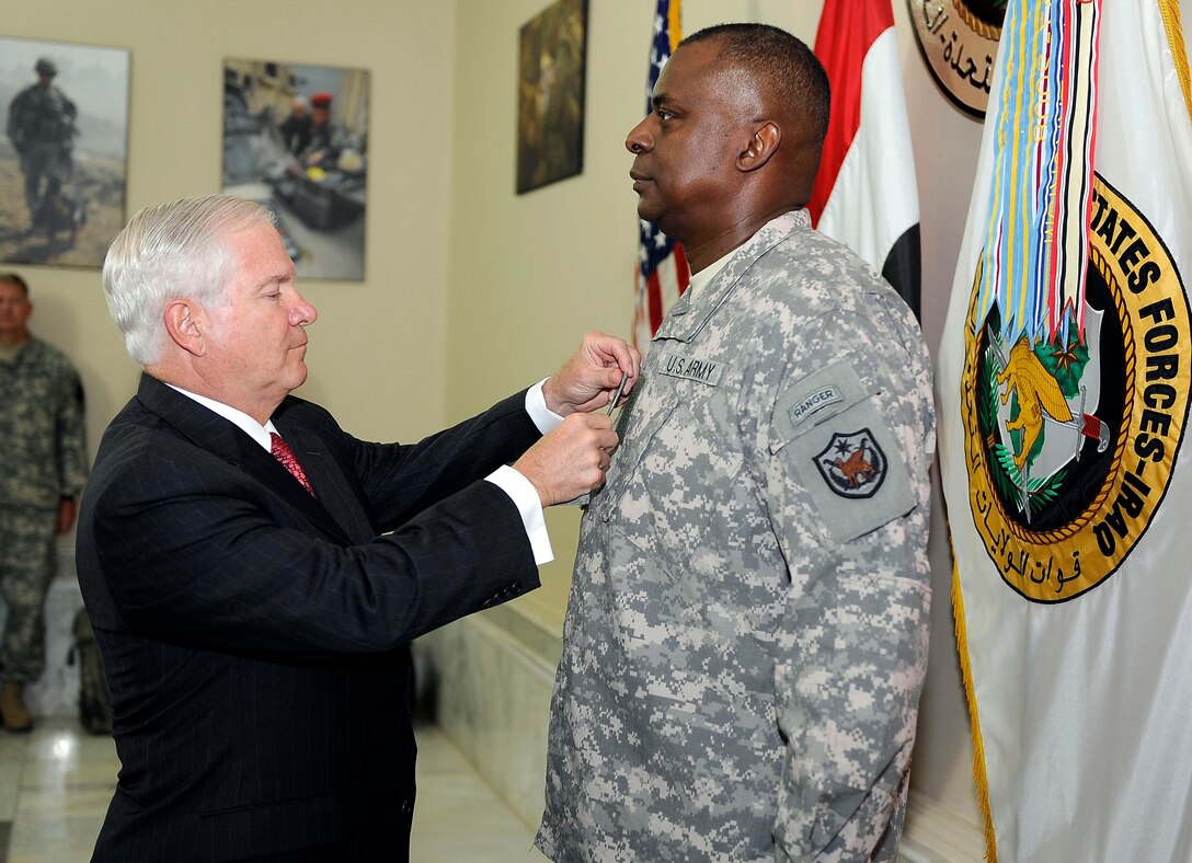 U.S. Defense Secretary Robert M. Gates promotes U.S. Army Lt. Gen Lloyd Austin III to general as he assumes command of U.S. Forces Iraq at the al Faw Palace on Camp Victory, Iraq, Sept.1, 2010.