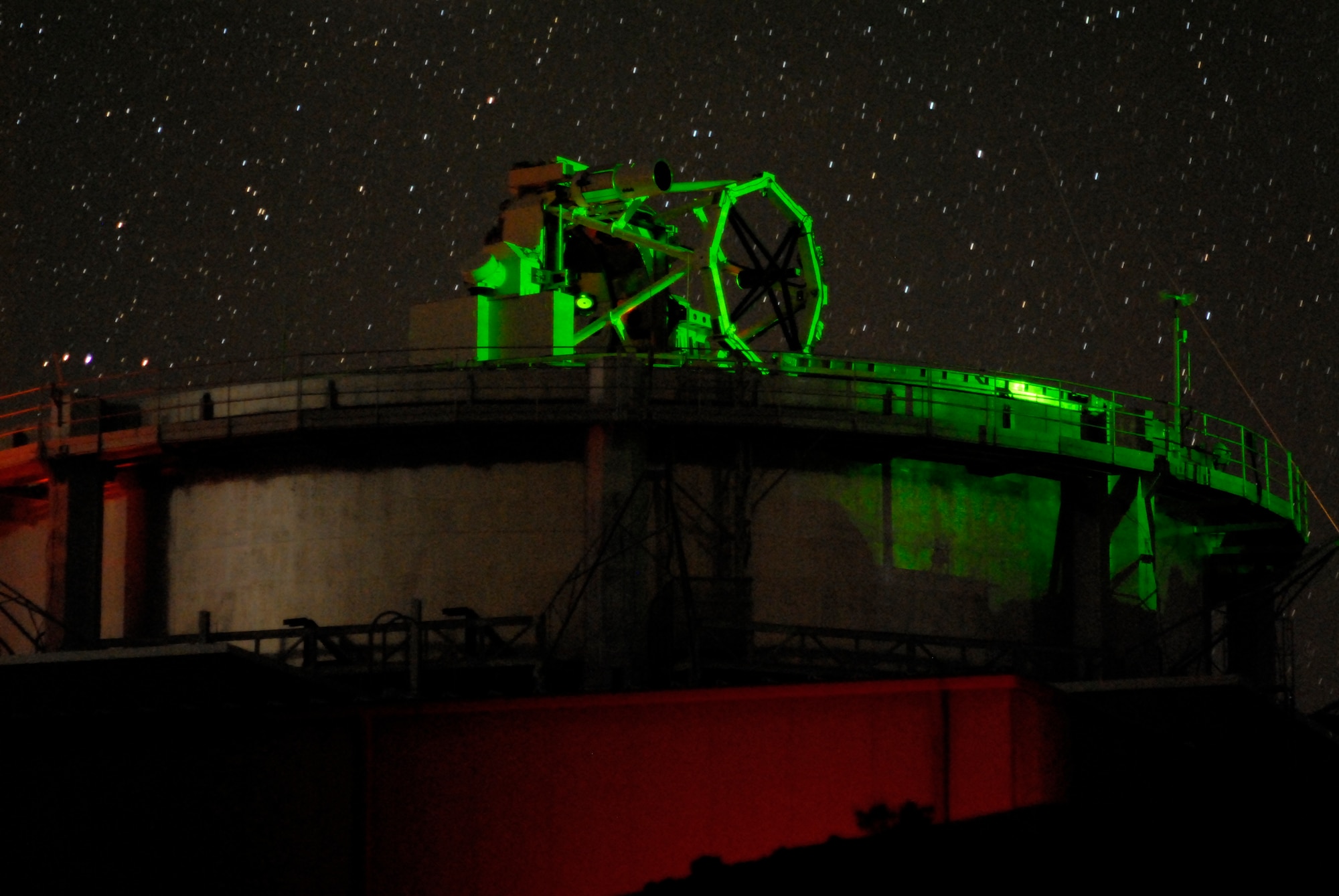 Air Force Research Laboratory’s 3.6-meter, 75-ton Advanced Electro-Optical System (AEOS) telescope under laser illumination at its Directed Energy Directorate’s Air Force Maui Optical and Surveillance Site, Maui, Hawaii.   The illumination resulted from the multi-wave length laser propagation experiments that were completed at over 10,000 feet and over a 90-mile path between Mauna Loa on the island of Hawaii and the Air Force site atop the extinct volcano, Haleakala, on Maui, Hawaii.      U.S. Air Force Photo by Rob Ratkowski                            